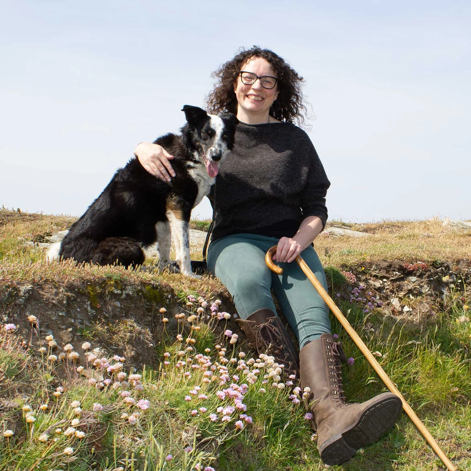 Southwest garden designer Rebecca Read and her dog on the cliffs of Boscastle.
