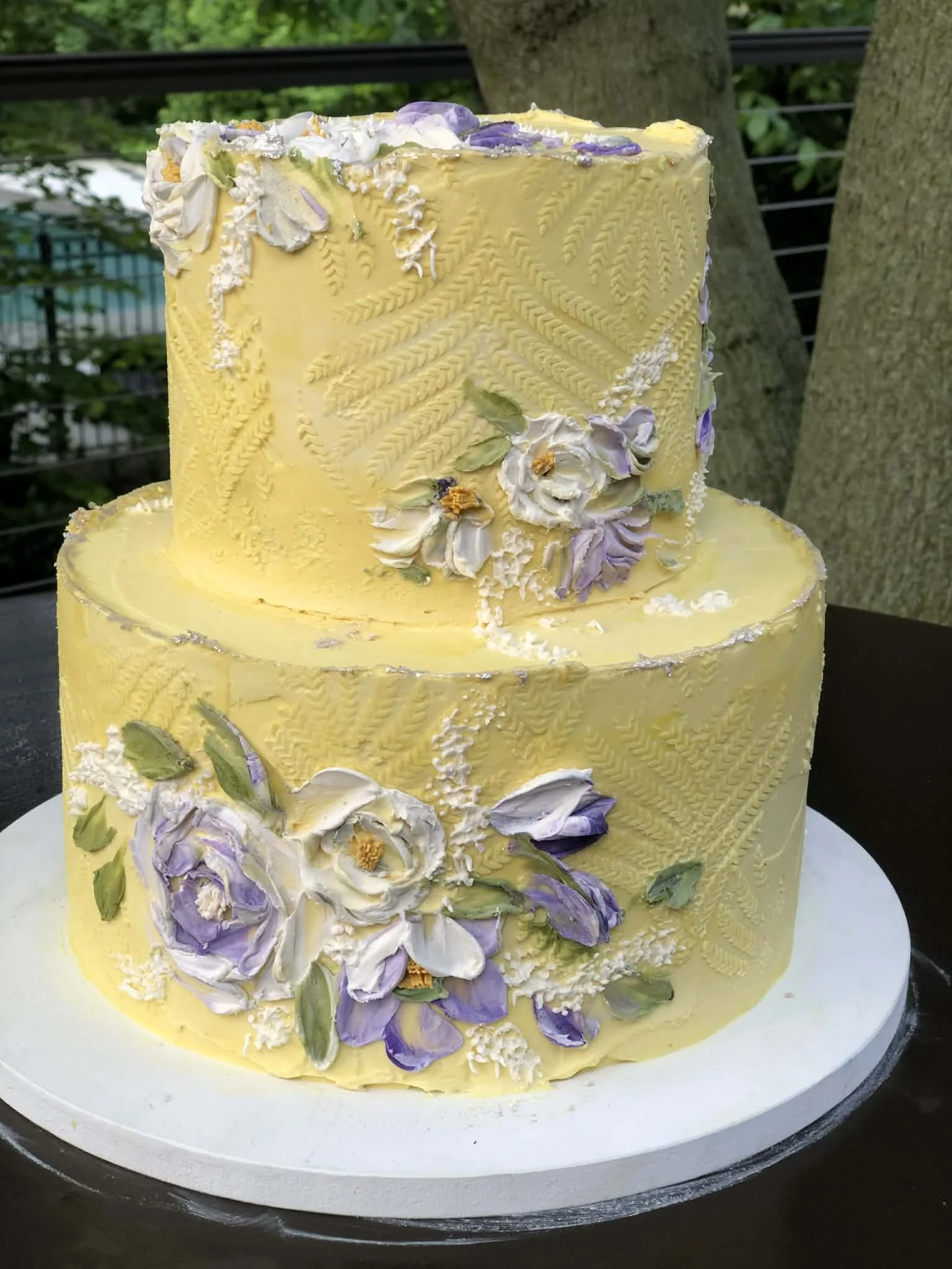 Sunny yellow texture with purple flowers
