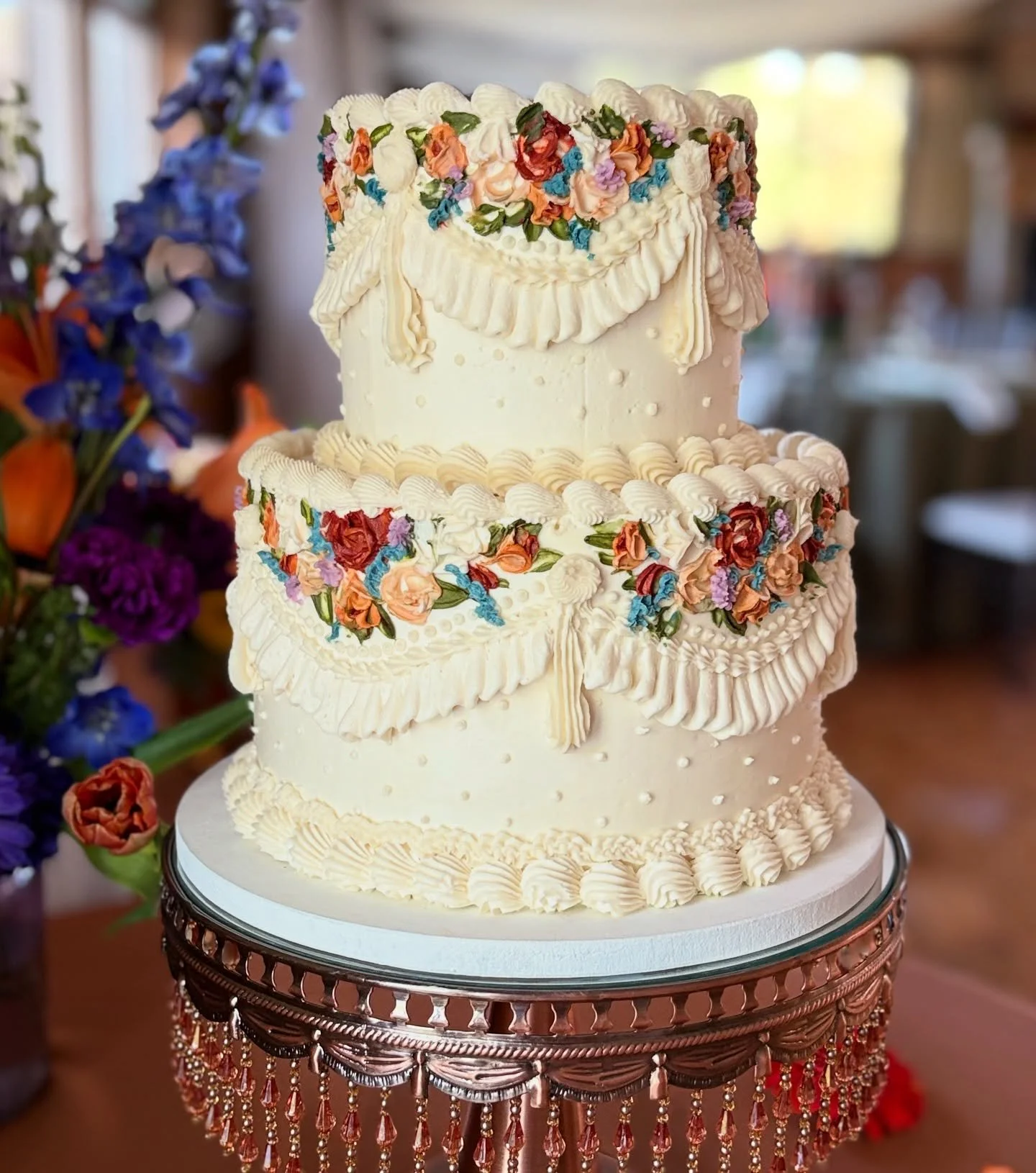 A combination of delicate palette knife florals and vintage white on white piping for this Drumore Estate carriage house wedding.