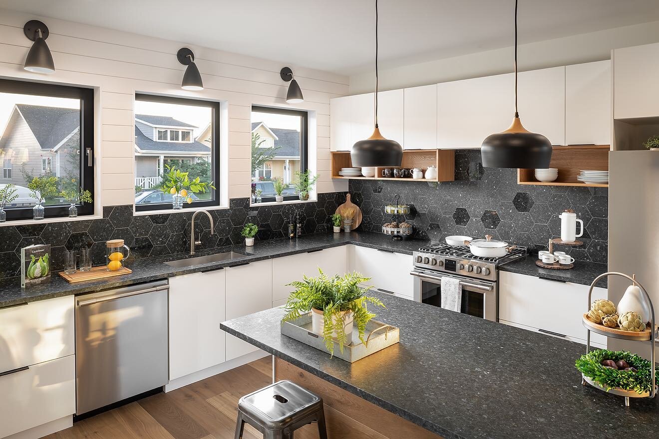 A kitchen made with some beautiful high-performance building materials supplied by us: Lundhs Real Stone tile and countertops, Helvex plumbing fixtures, Innotech windows, and Haro flooring. Contact us to learn more about buying wholesale materials fo