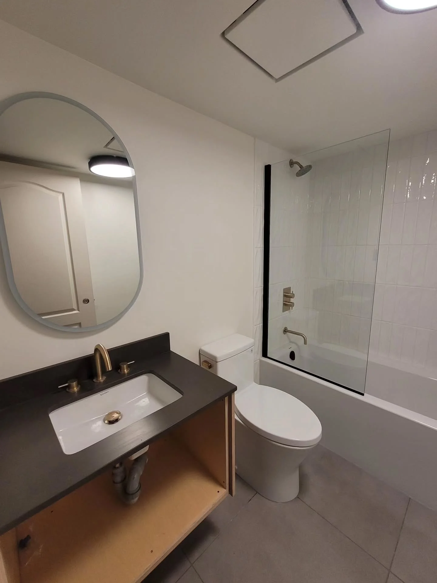 Some gold finishing trims for this North Vancouver guest bathroom