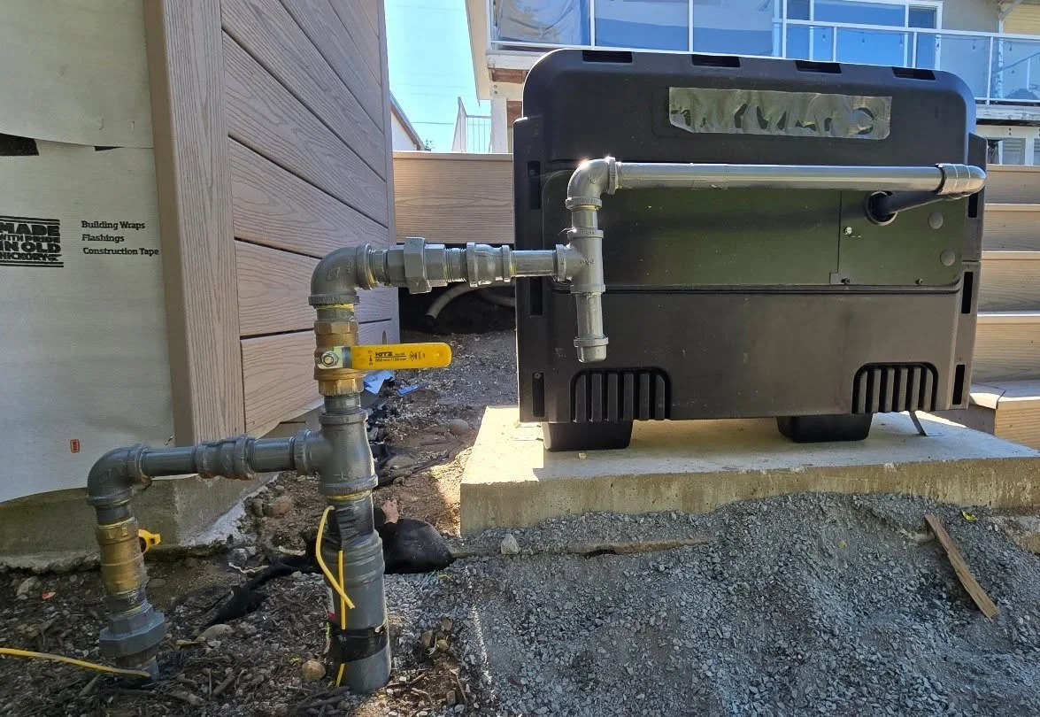 We brought a new underground gas service 70' down the side of the house, to supply this pool heater and an outdoor fire pit. A big transformation for this backyard!