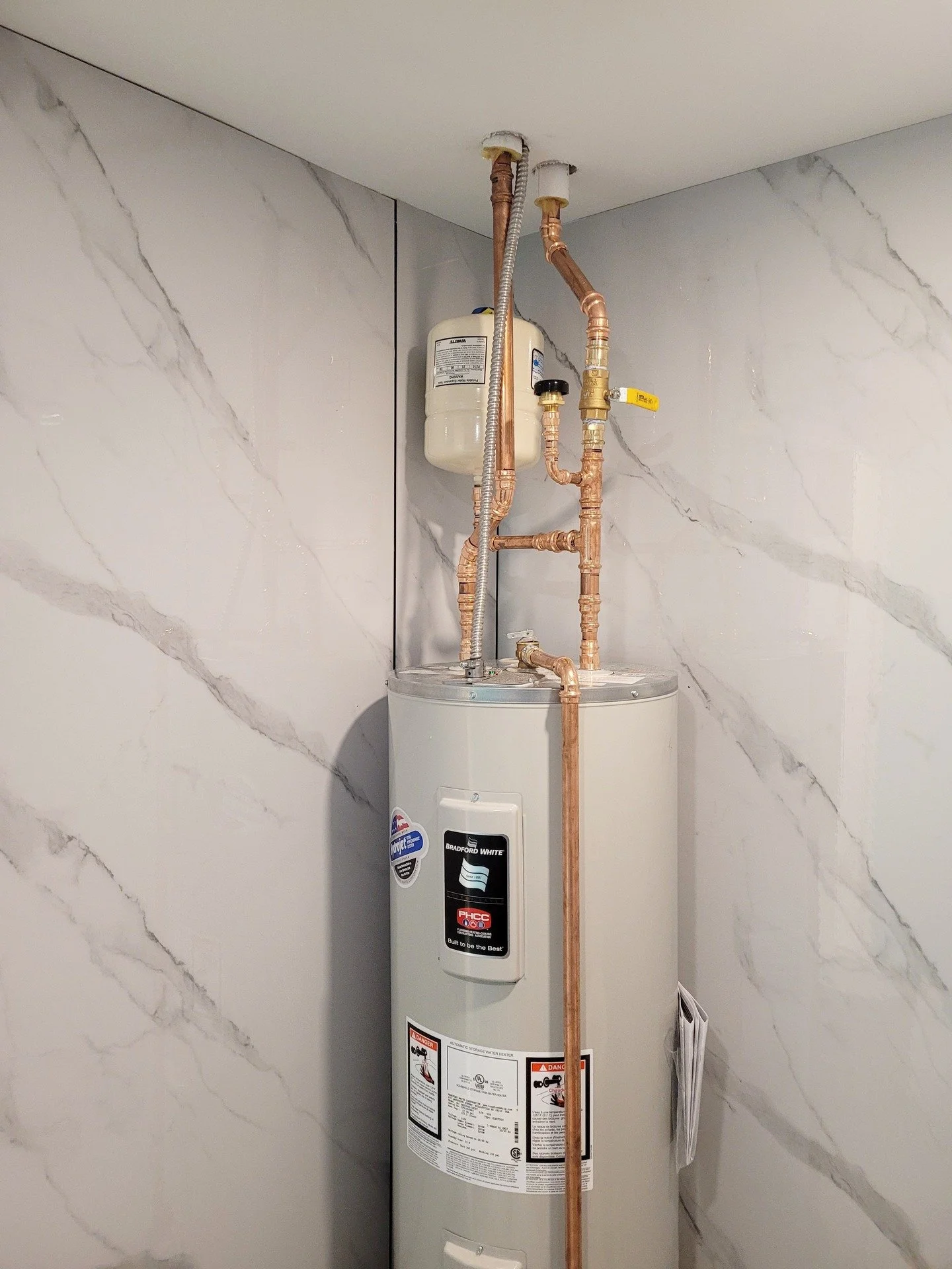 Hot water tank install for this commercial TI