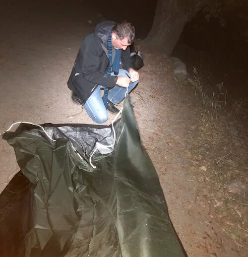 Setting up the tent, for the first time, in the dark (photo by Hannah)
