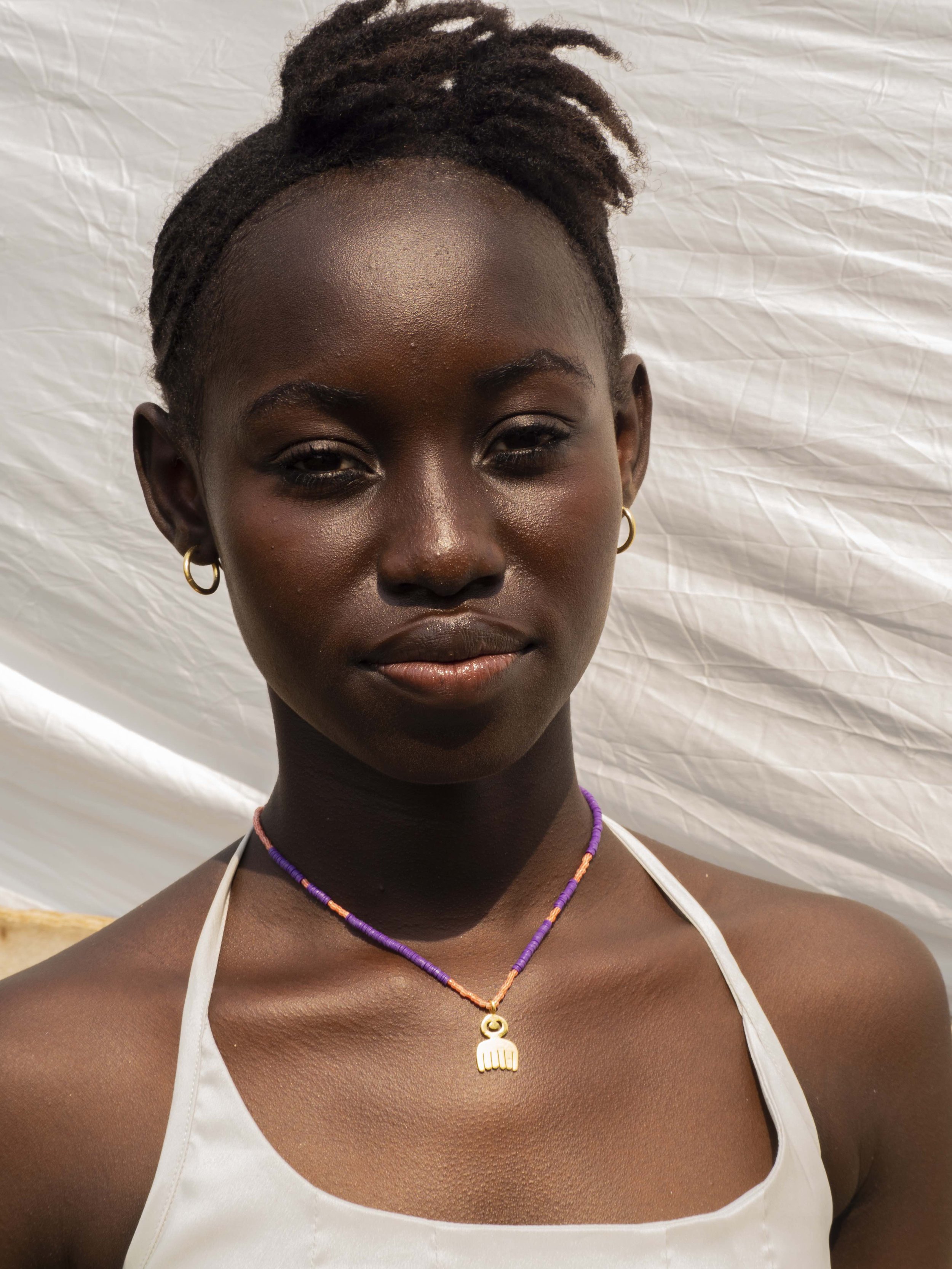 aketekete-handcrafted-jewelry-adinkra-symbol-yina-necklace-new-colors-made-in-ghana