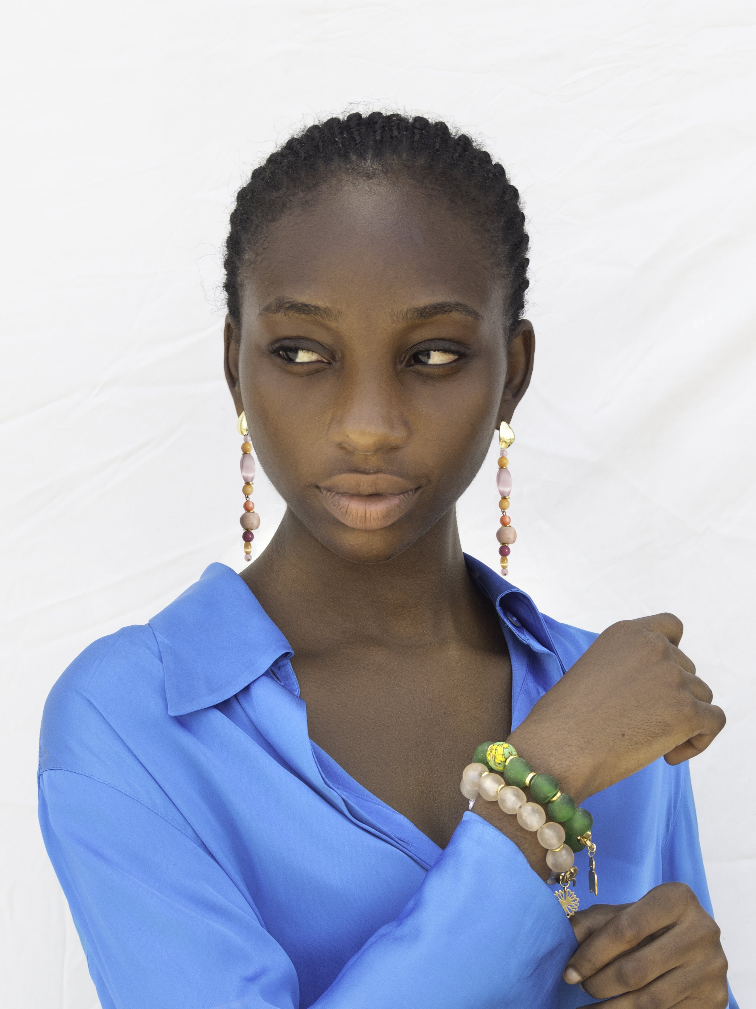 TUMI BRACELET CRAFTED IN GHANA BY LOCAL ARTISANS WITH RECYCLED GLASS BEADS AND 24K GOLD PLATED ADINKRA BRASS PIECES THAT SERVE AS POWER STONES WITH MEANINGS (1).jpg