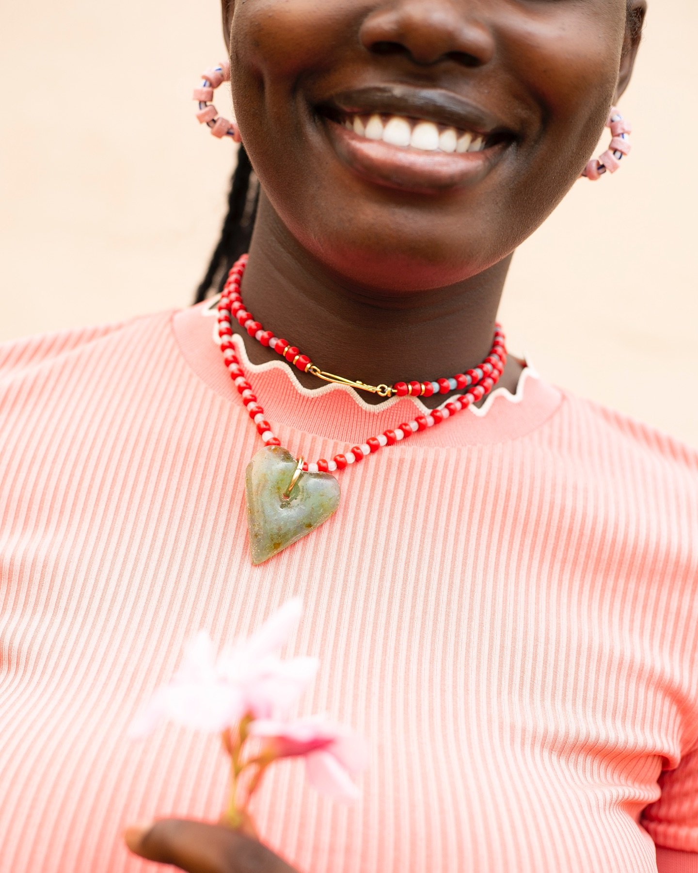 A SILHOUETTE OF JOY

A molten heart, suspended on a red beaded cord.
 
 
Our Anigye&epsilon; Necklace is back in stock in a very limited quantity! Only 5 pieces were created! Featuring unique heart-shaped beads and locally sourced old glass beads. Th