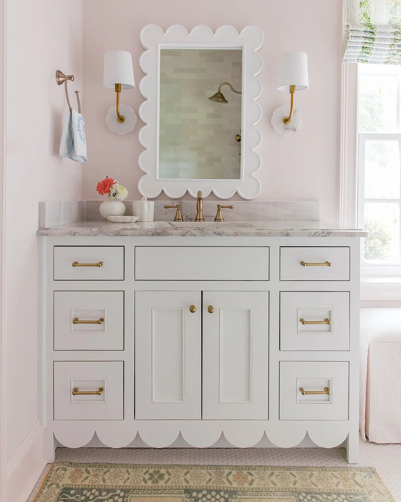 This custom scalloped vanity we designed for this little girl&rsquo;s bathroom is the perfect mix of sweet, feminine, and classic. 💕