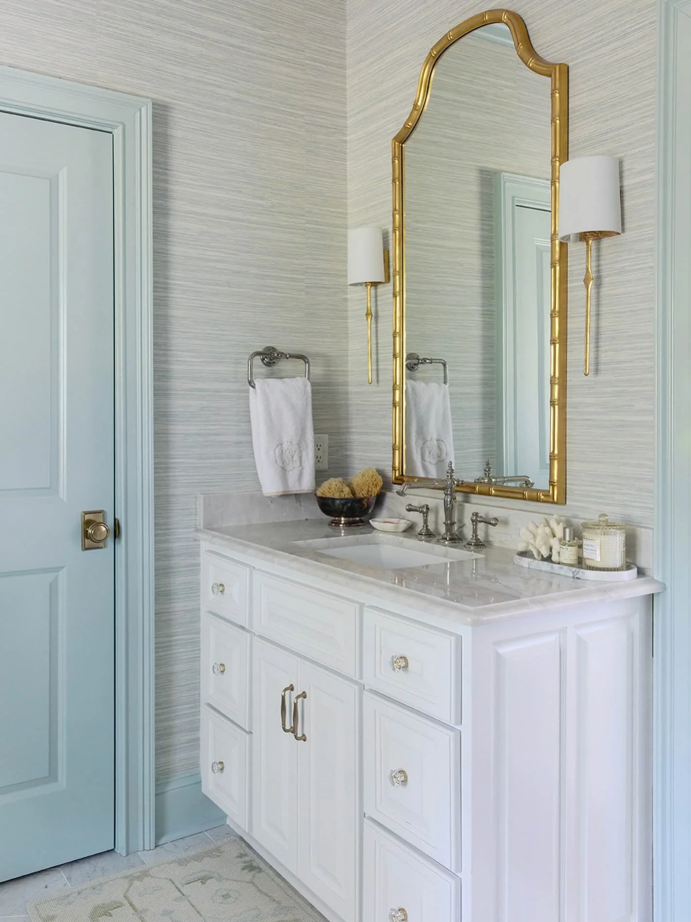 For those that want a little texture and color, but are scared of committing to a bold wallpaper, this pale blue grasscloth is a great option. We wanted to add some more punches of color, so we went all in with blue trim/doors. We always encourage ou