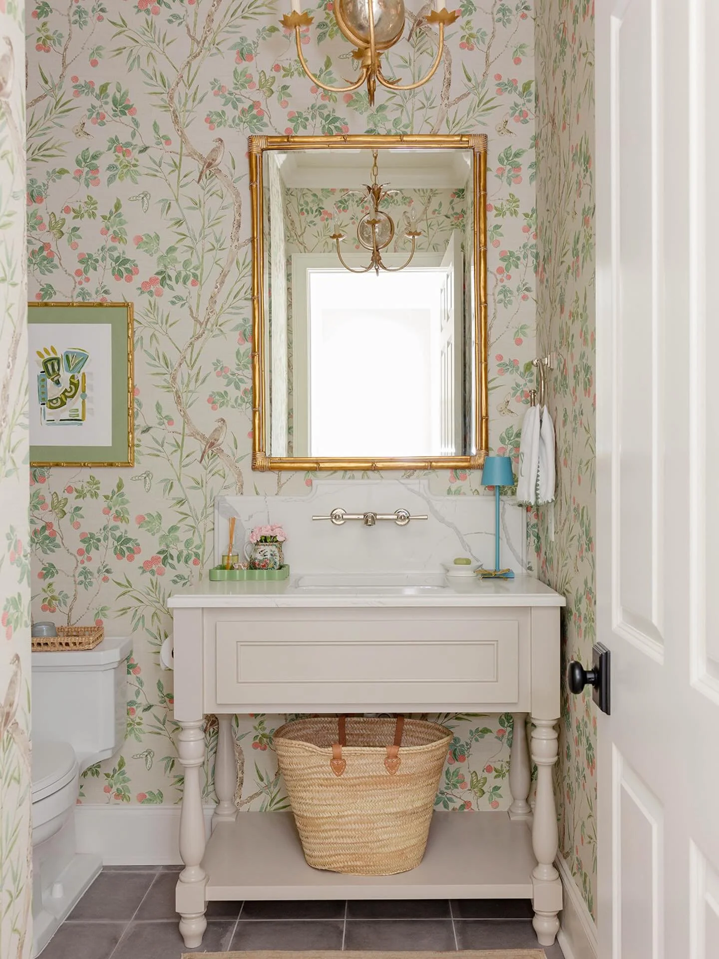 This powder bathroom in my home is like a dark cave, but somehow @carolynallenphotography made it feel light &amp; bright with her 📷 magic. I have a favorite garden stool tucked into the corner with blues, greens, and pinks - all my favorite colors 