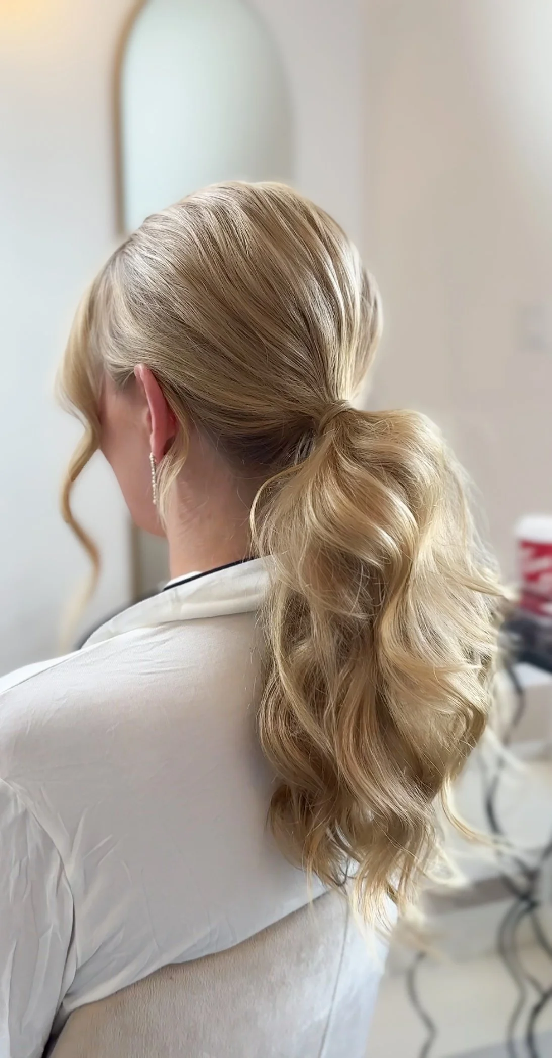 Blonde bride with soft low ponytail bridal hairstyle by Danielle Aichelle Artistry in Red Deer