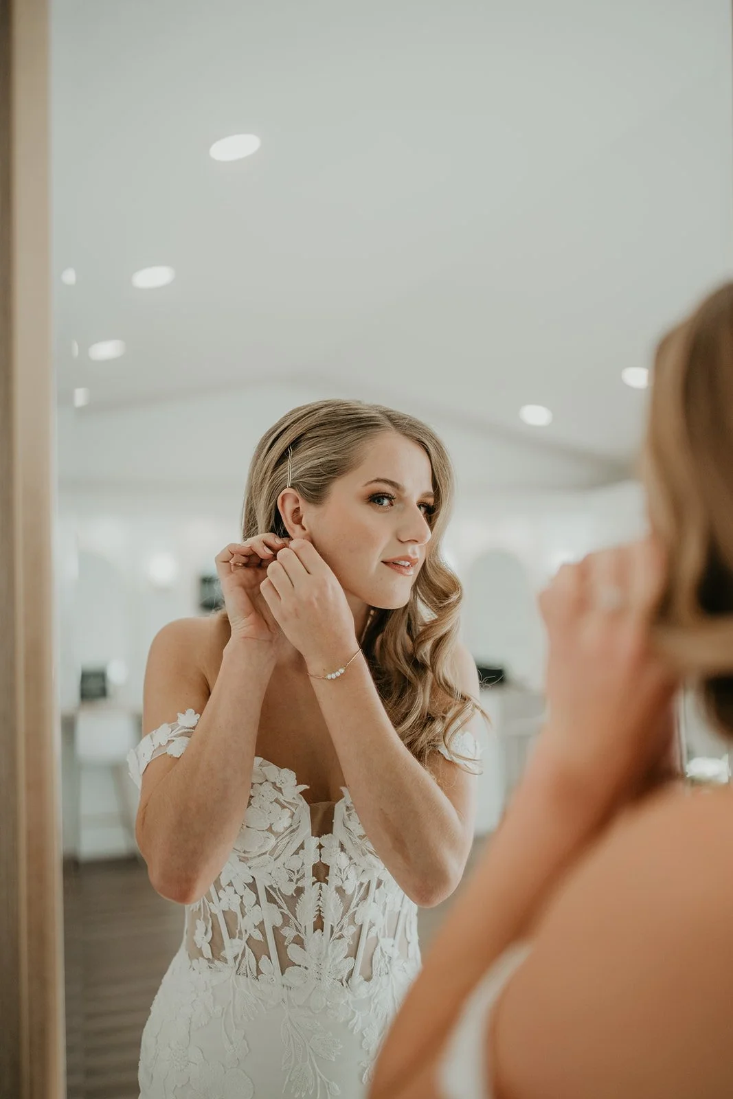 Bride with soft romantic waves getting ready for her winter wedding at River Valley Wedding Venue
