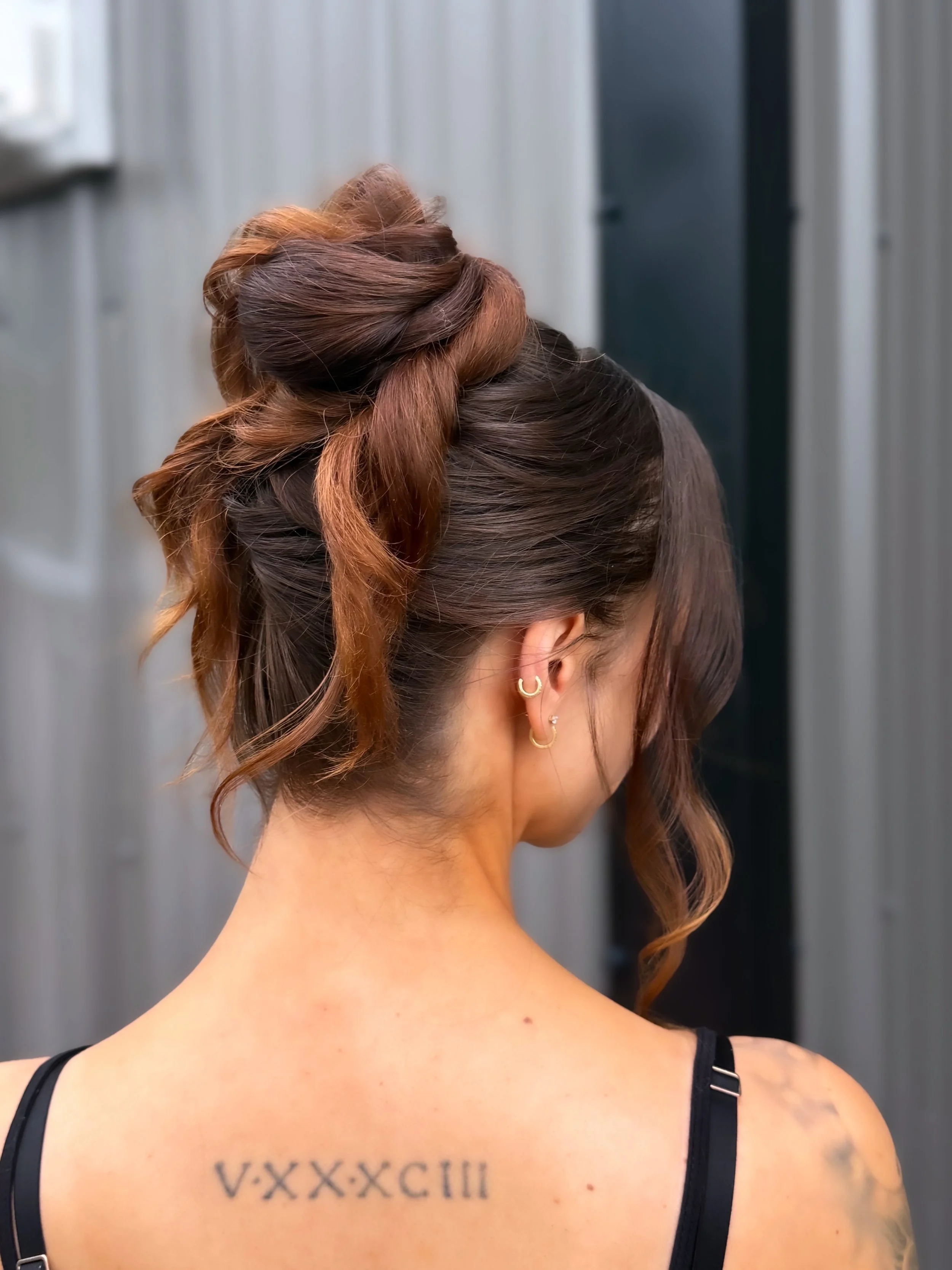 Elegant textured bridal updo styled by Red Deer bridal hairstylist Danielle Aichelle Artistry for a wedding at 52 north wedding venue in central Alberta