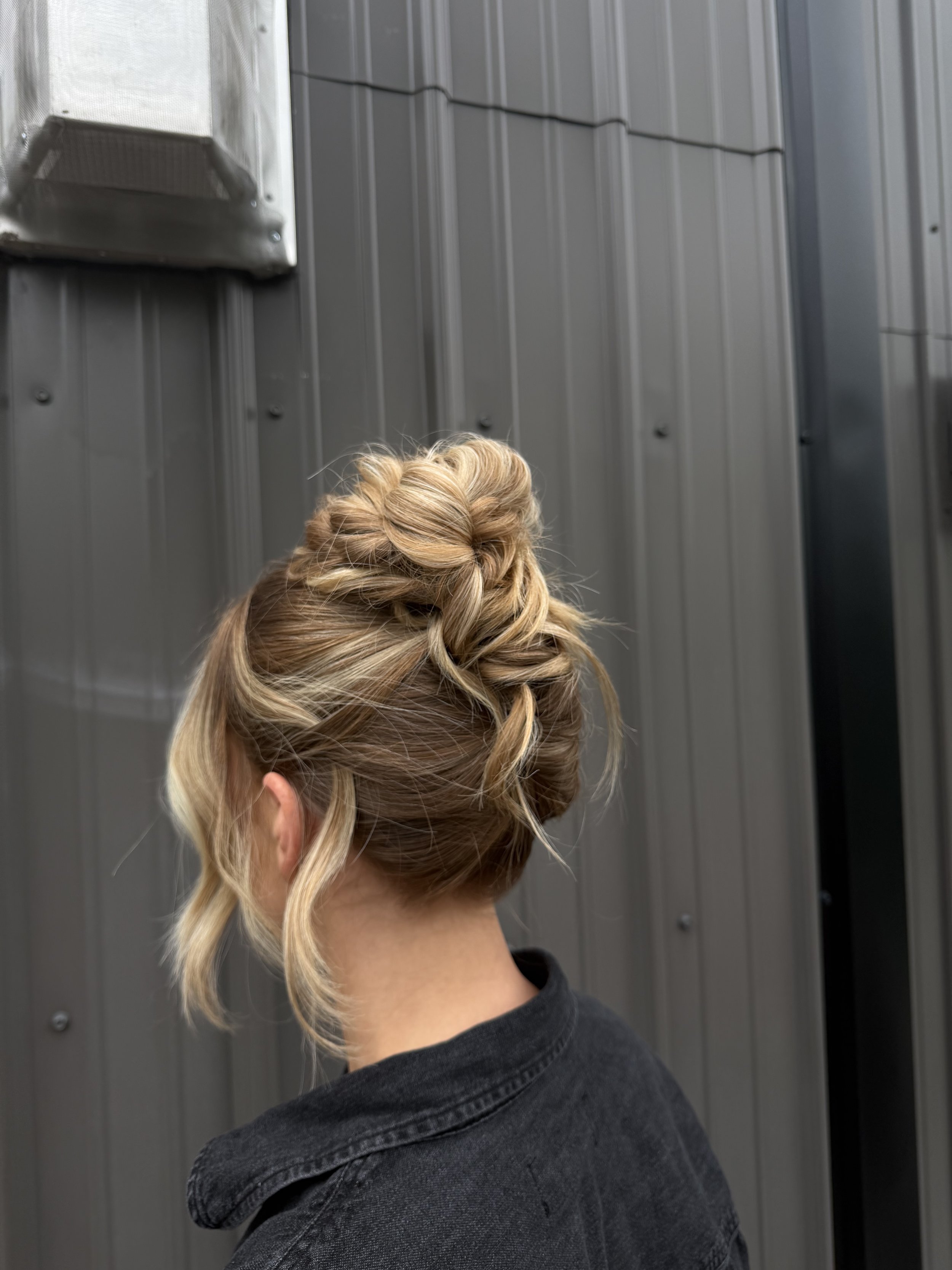 Textured blonde bridal updo styled for a wedding at 52 north wedding venue