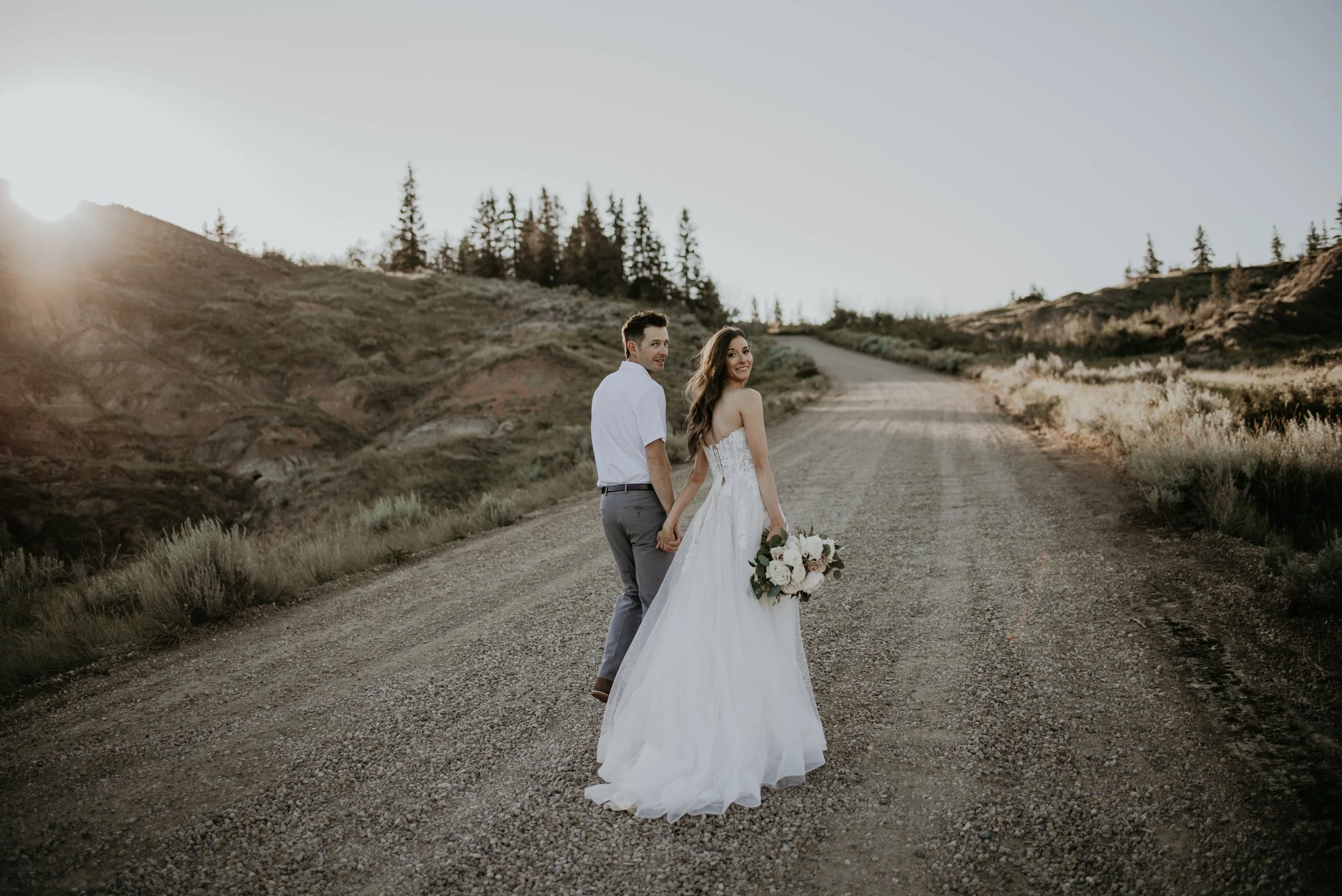 Bride and groom during a sunset elopement photographed by Drumheller elopement photographer Danielle Aichelle photography