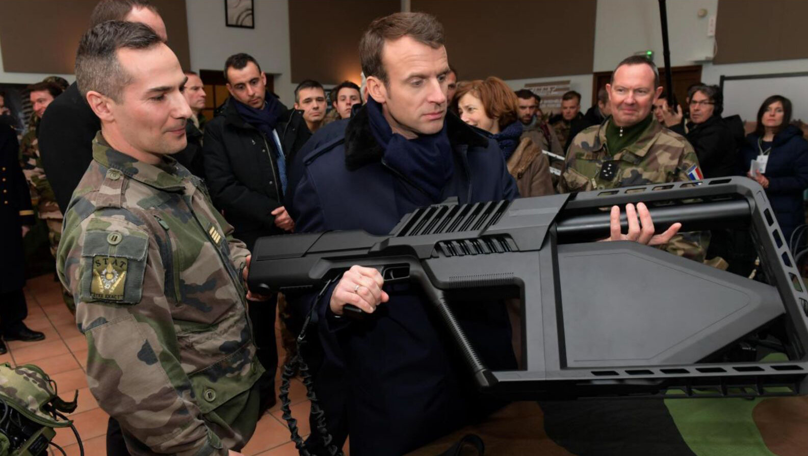 French President Emmanuel Macron reviews the DroneGun Tactical