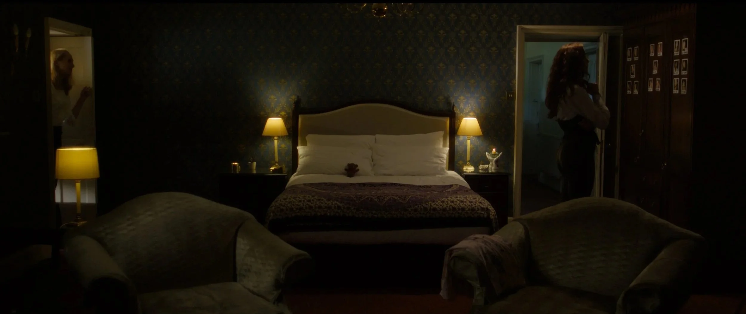 Two women stood in a bedroom at opposite sides in Lure (2026) horror fillm