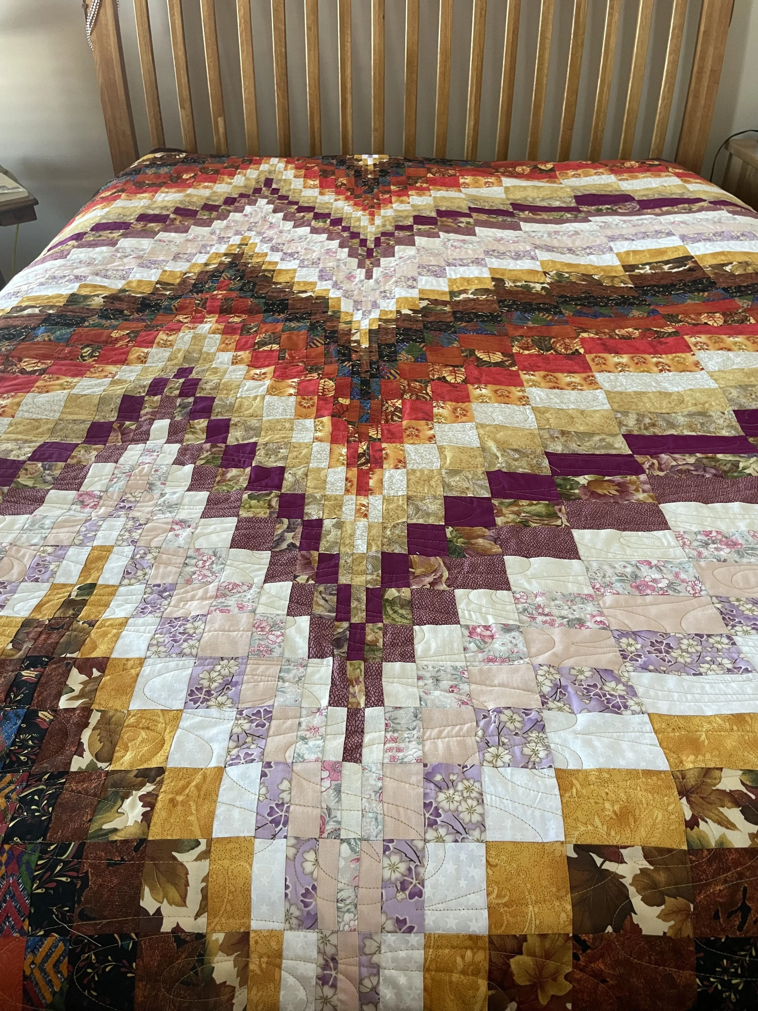 A beautiful fall bargello quilt.  All fabrics pulled from my customer's stash.  These quilts remind me of water and waves.  Pantograph "Ripple"