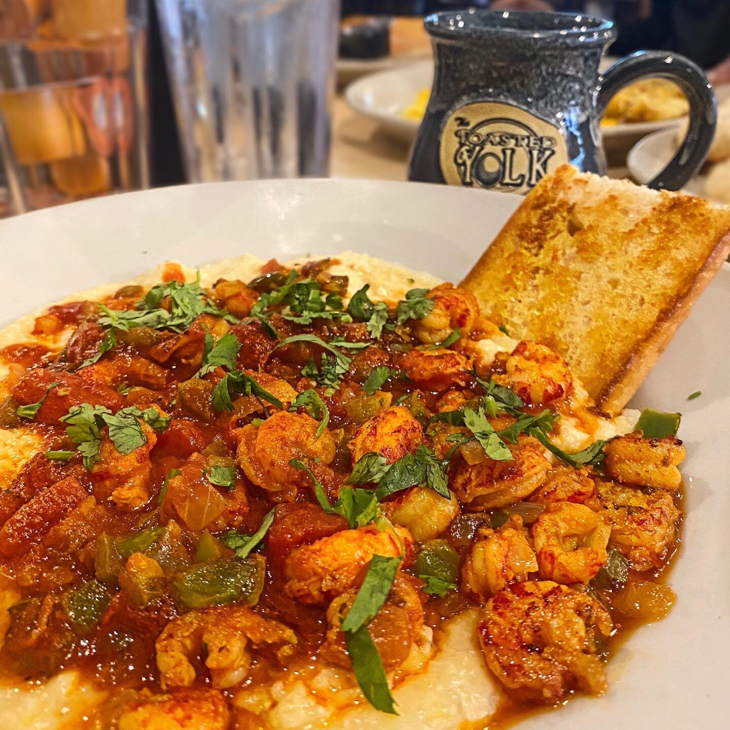 We filed this under &quot;breakfasts we could have every day &quot;🤯😍
.
.
On the plate: &quot;Tails and Grits&quot; crawfish and spicy Creole sauce.
.
.
.
#thetoastedyolk #breakfast #brunch #crawfish #grits #goodfoodgurus #gfg #foodiesofinstagram #