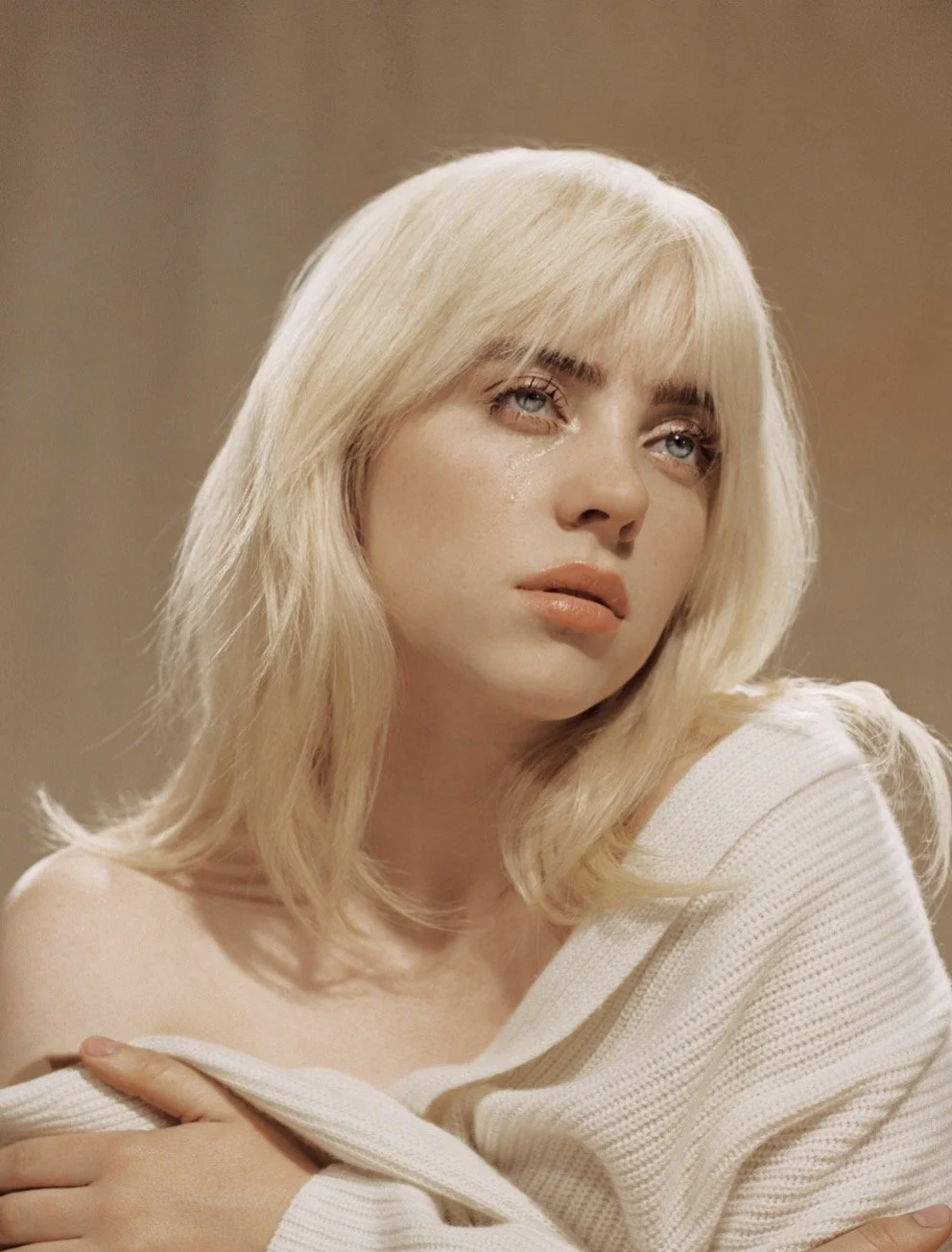 Billie Eilish began singing when she was 8 years old and began writing music when she was just 11 years old. Her debut single, "Ocean Eyes" released in 2014 when she was 13 years old, and she was promptly signed to her first record label at just 14. 