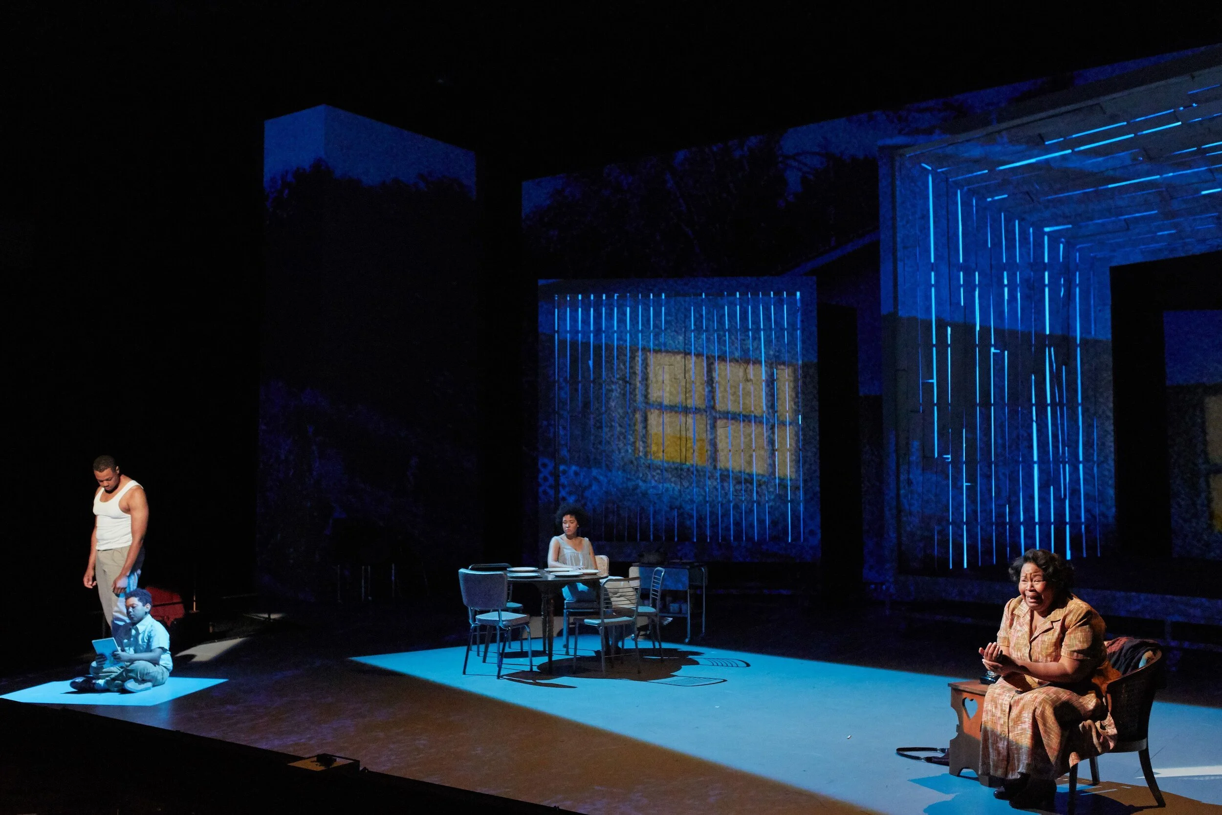 Cast on stage performing. Fire Shut Up In My Bones