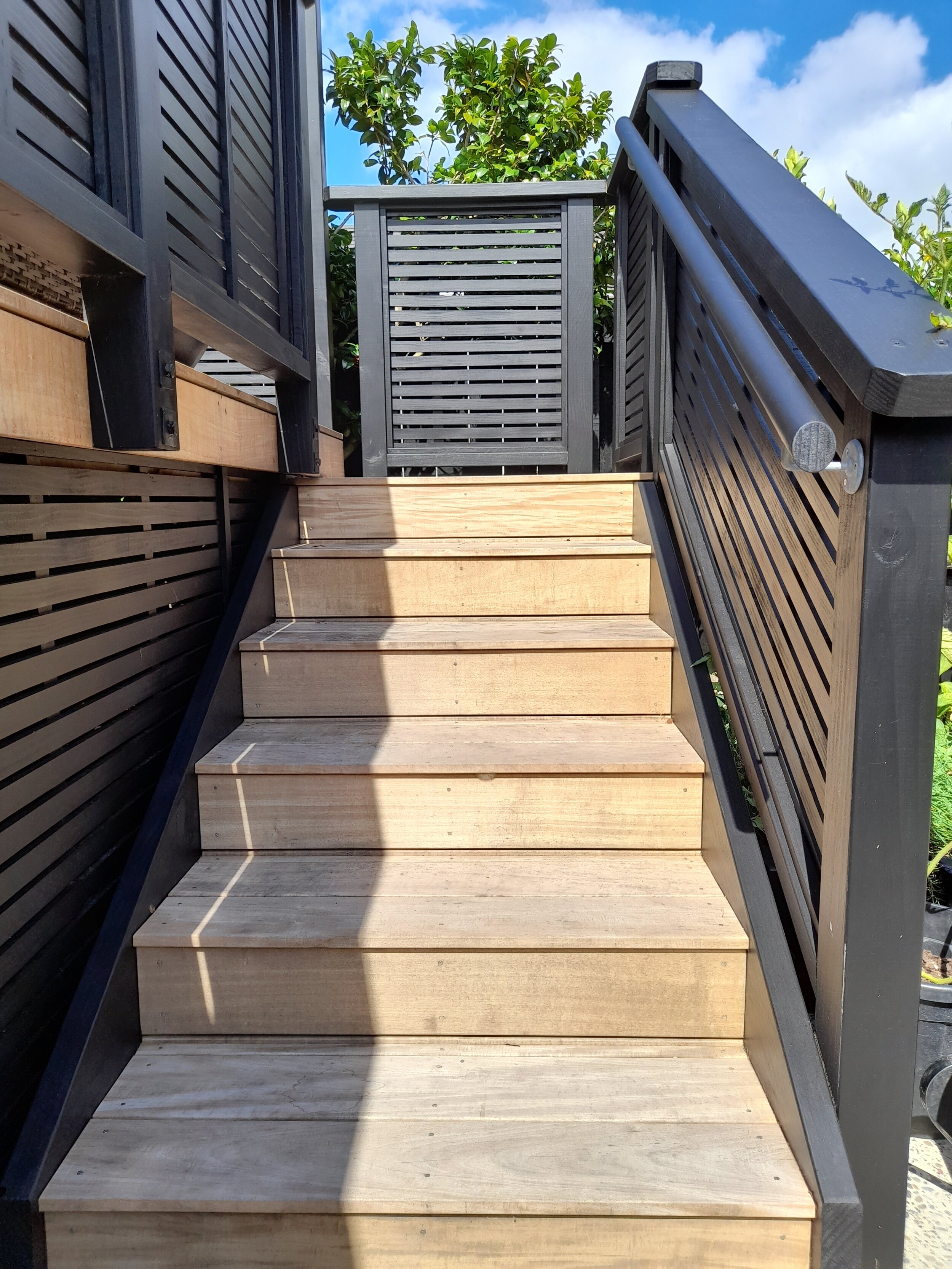 The new stairs leading onto the deck have a safety handrail for ease of use