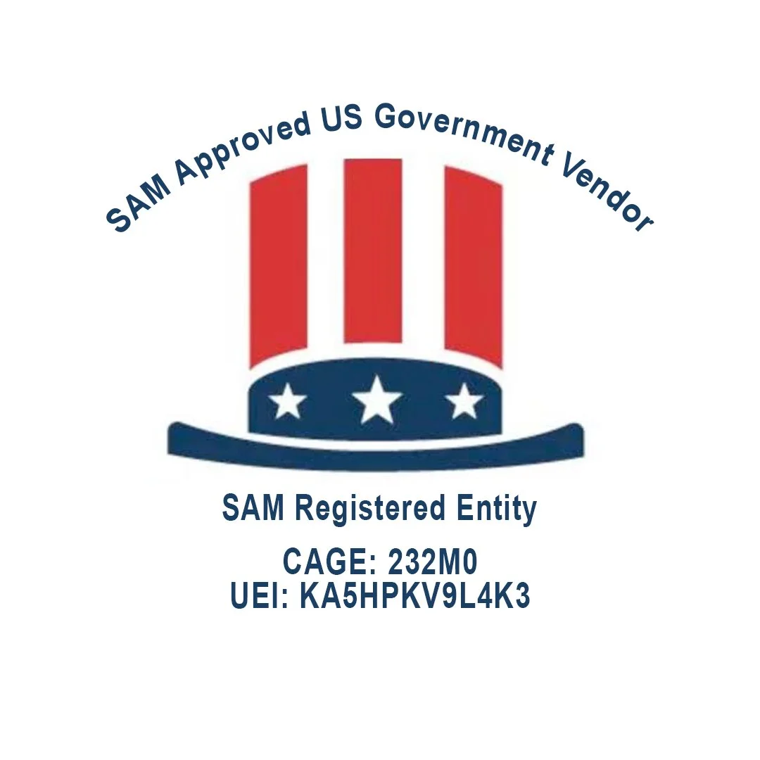 A badge with red, white, and blue colors, featuring a hat with stars and stripes, indicating it is a SAM approved US government vendor, with registration and identification details.