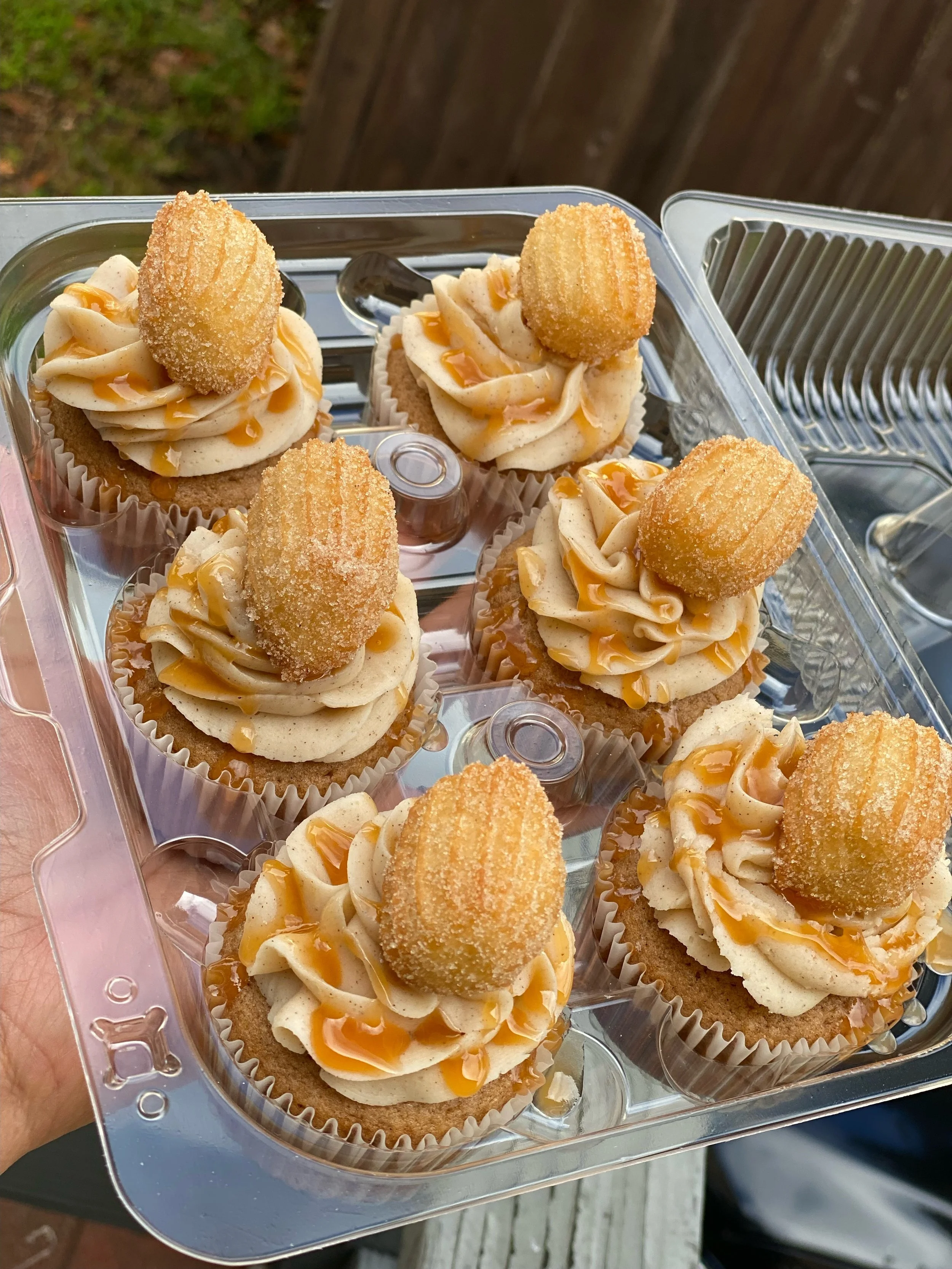 [Best Seller] The Churro Cupcake: Cinnamon Cupcake paired with a Cinnamon Buttercream topped with a Homemade mini Churro and Caramel Sauce drizzle 