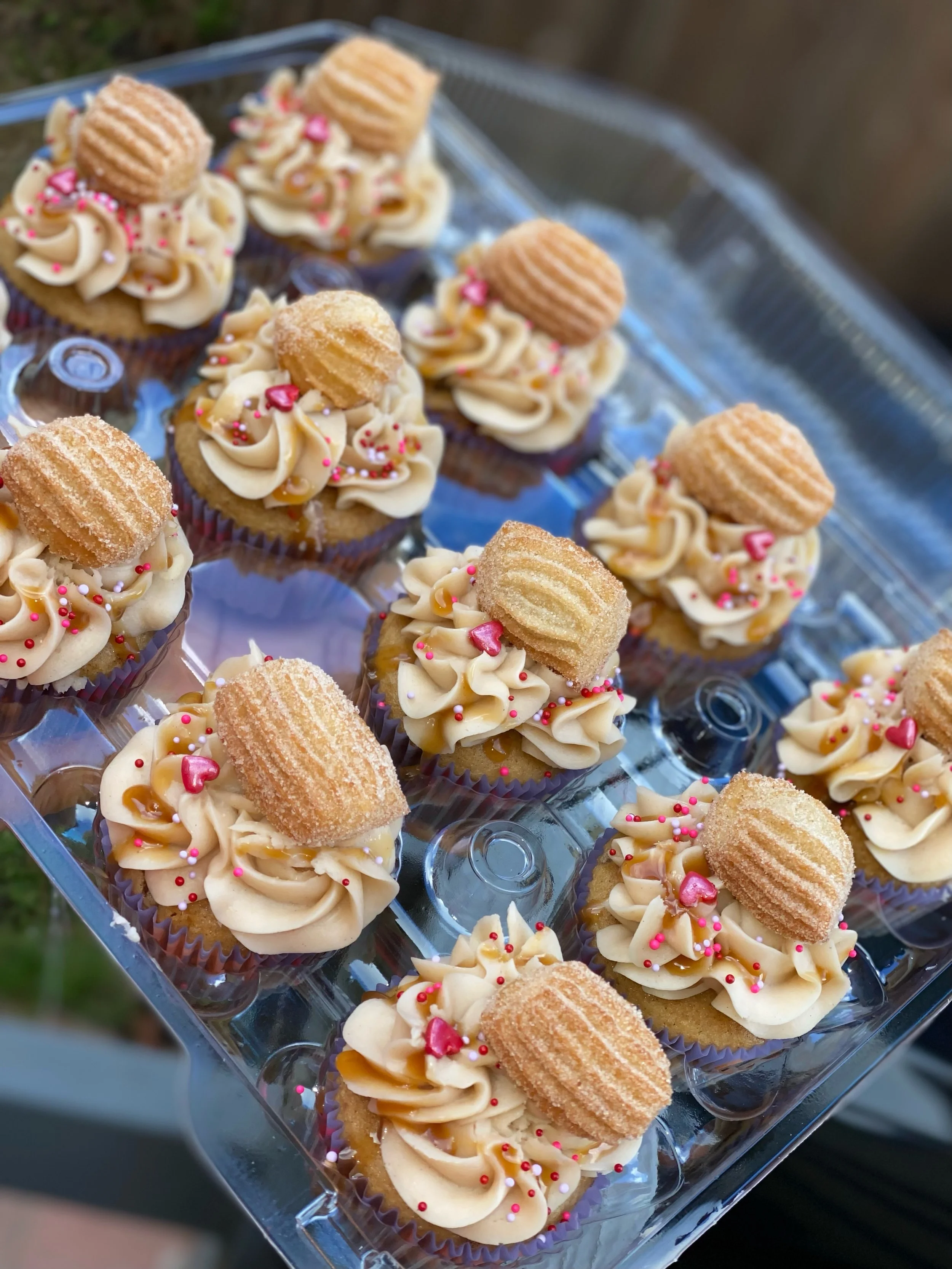 [Best Seller] The Churro Cupcake: Cinnamon Cupcake paired with a Cinnamon Buttercream topped with a Homemade mini Churro and Caramel Sauce drizzle 