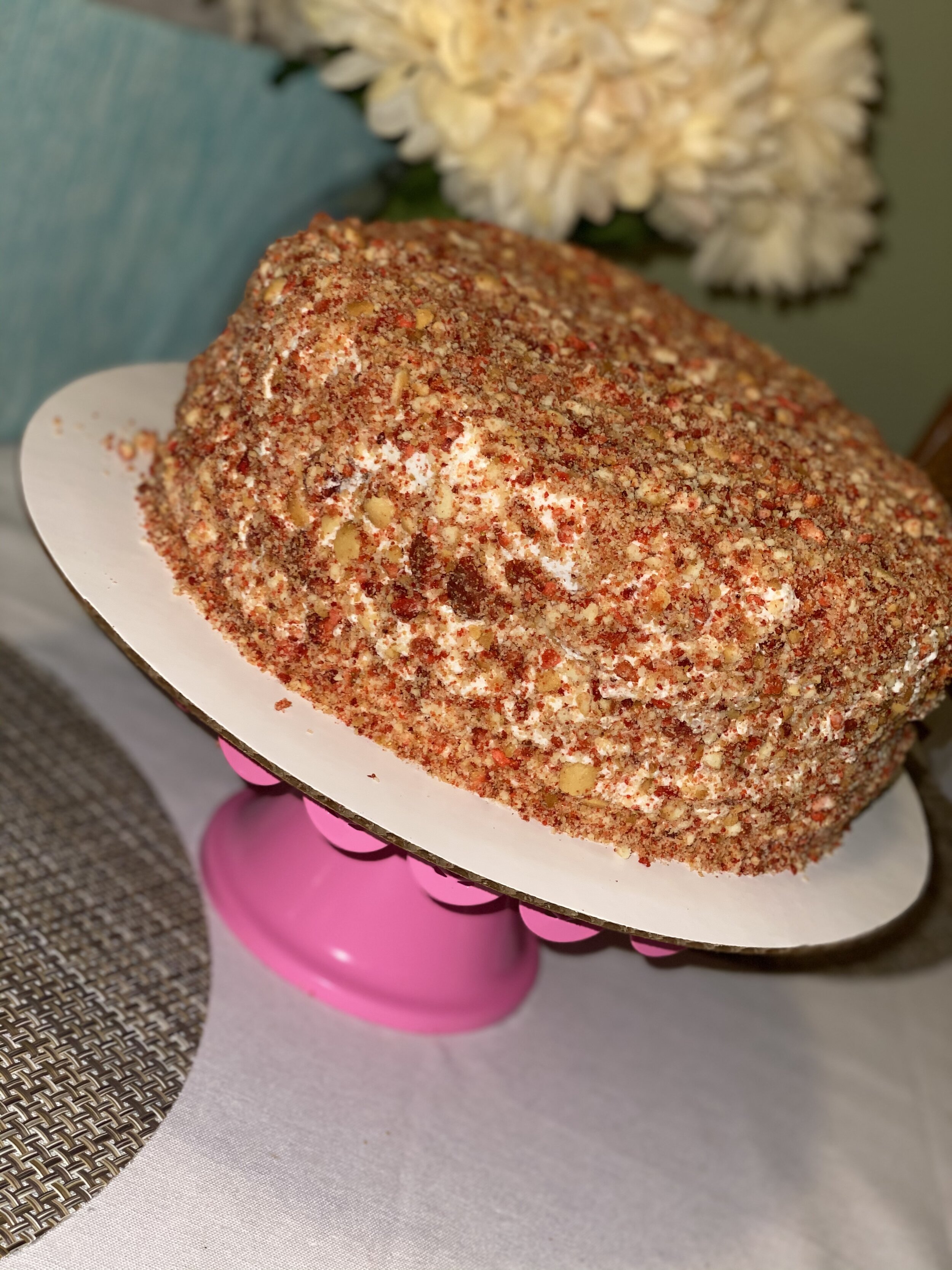Berry Crunch Cake: Strawberry Cake Layers Strawberry Vanilla Buttercream covered in Strawberry Shortcake Crunch