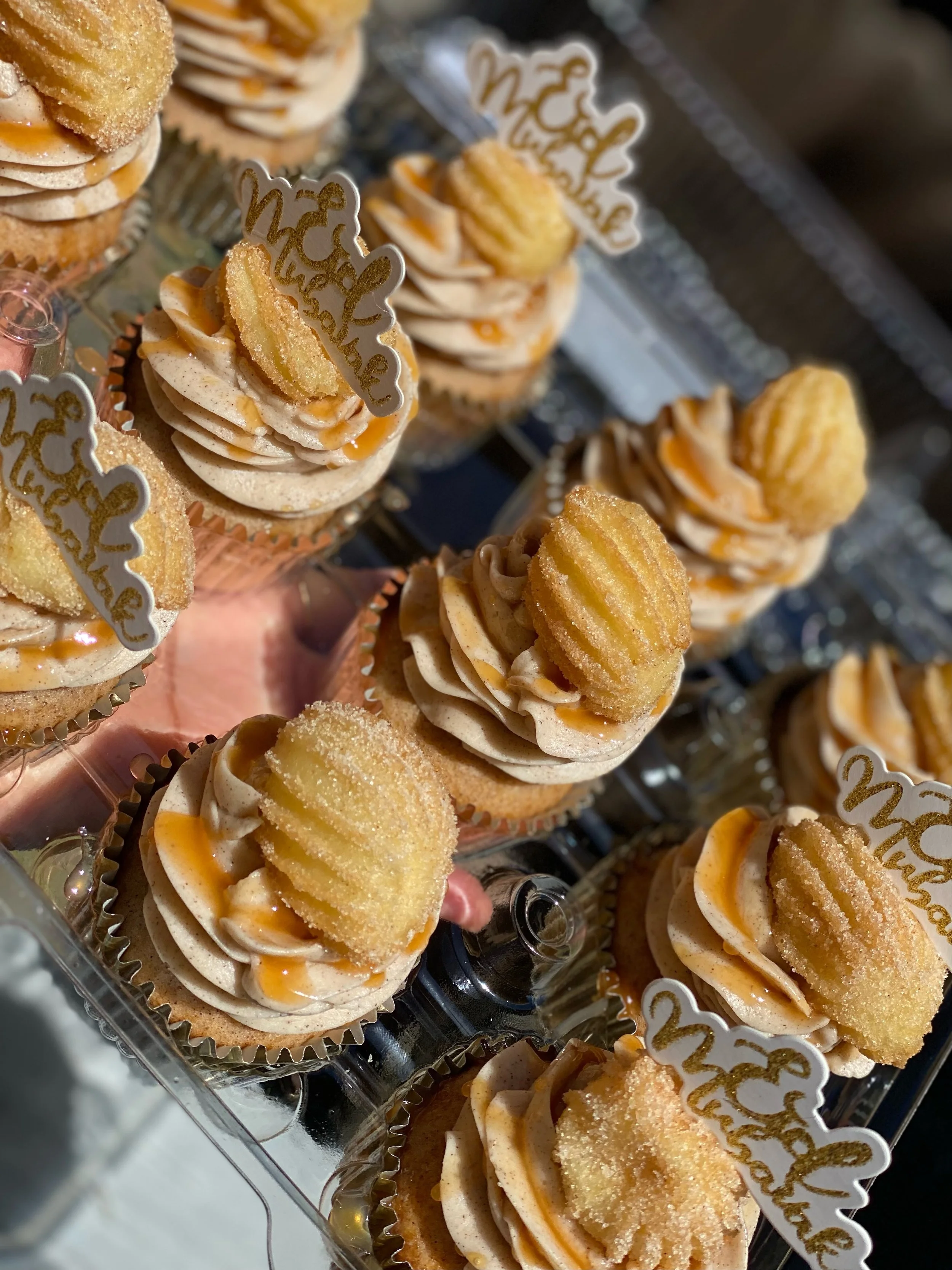 [Best Seller] The Churro Cupcake: Cinnamon Cupcake paired with a Cinnamon Buttercream topped with a Homemade mini Churro and Caramel Sauce drizzle 