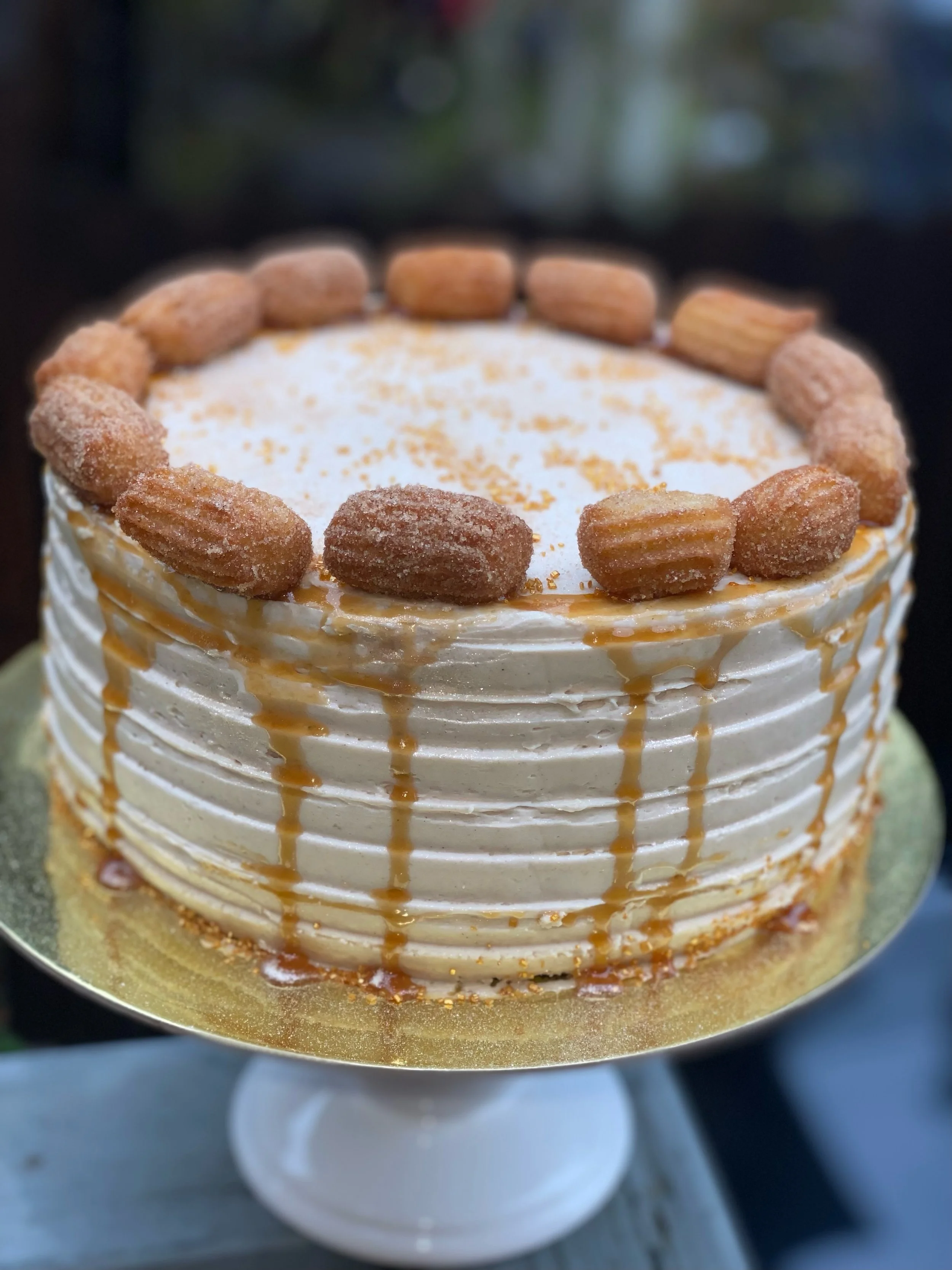 The Churro Cake: Cinnamon Cake Layers Cinnamon Buttercream Homemade Caramel Sauce drizzle and Homemade Churros [BEST SELLER]