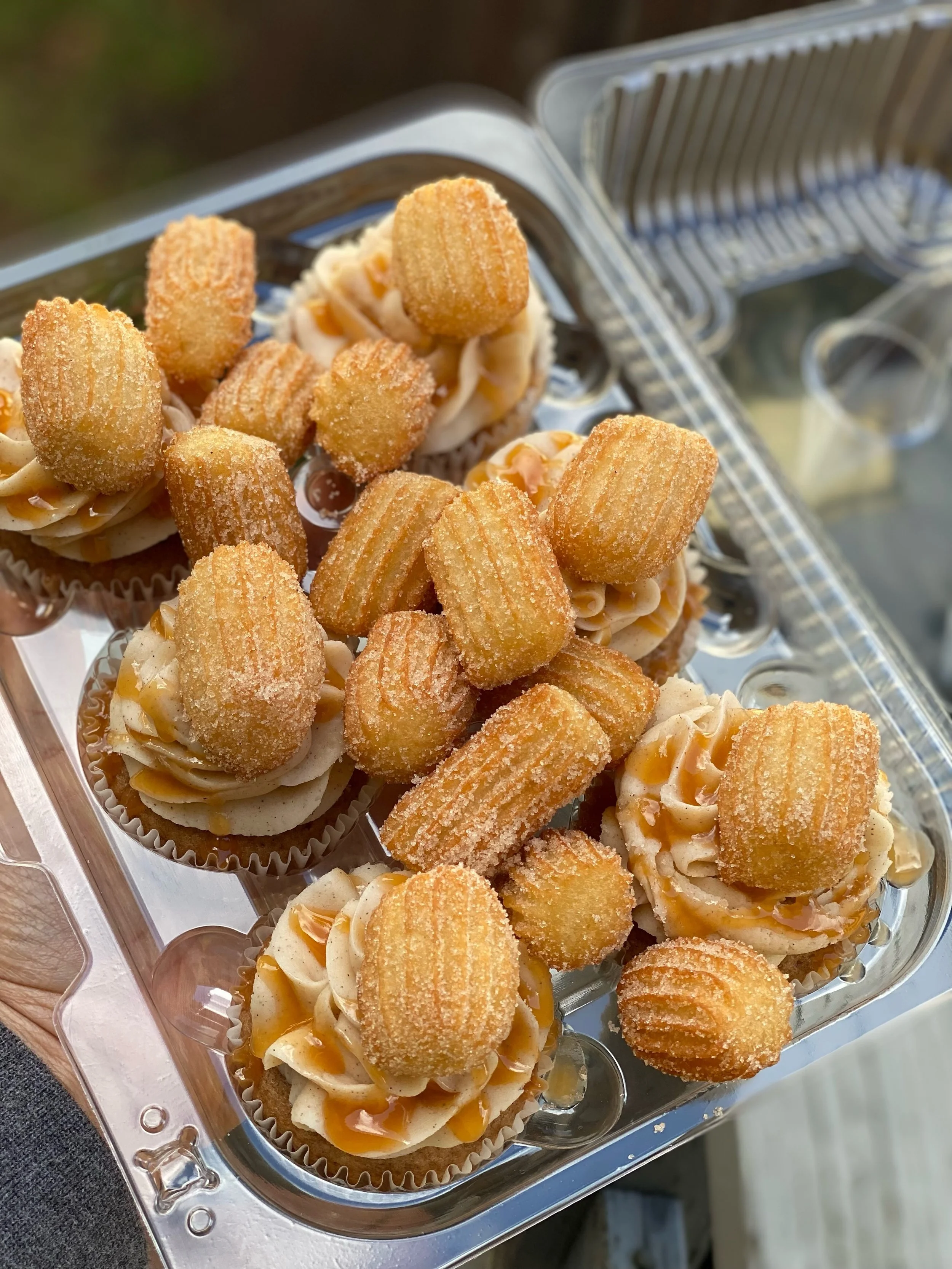 [Best Seller] The Churro Cupcake: Cinnamon Cupcake paired with a Cinnamon Buttercream topped with a Homemade mini Churro and Caramel Sauce drizzle 