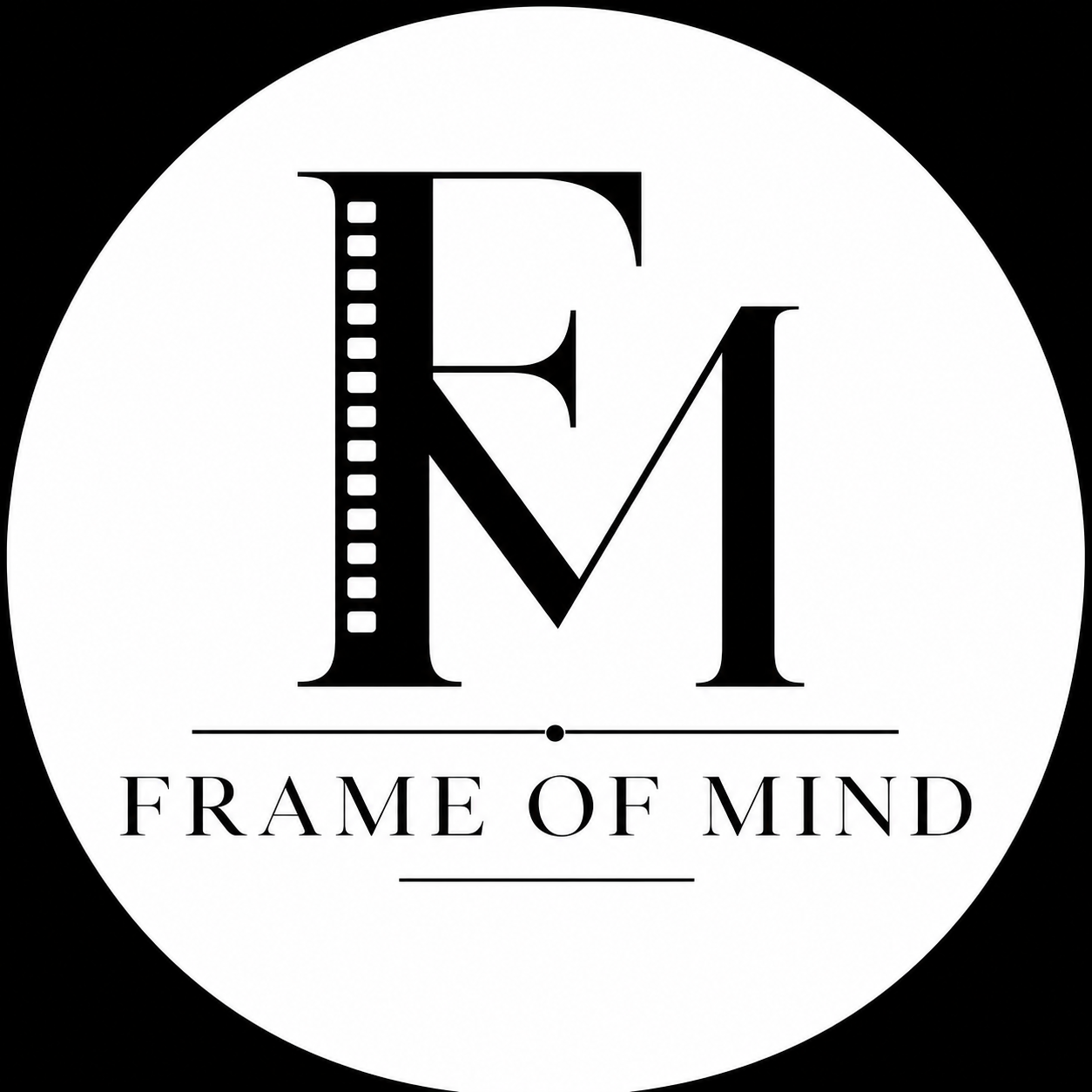 Black and white logo with large initials 'F' and 'M' at the center, and the words 'FRAME OF MIND' below, separated by a horizontal line, within a circular background.