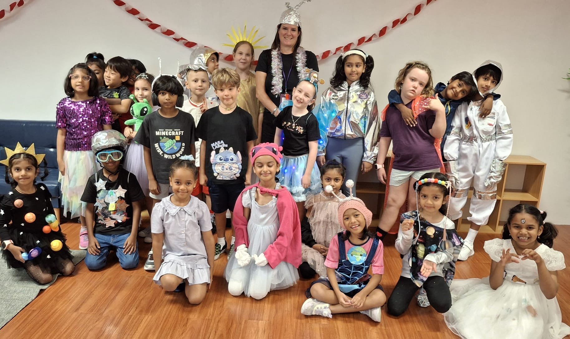 k12 foreign students in costume posing for photos changi business park