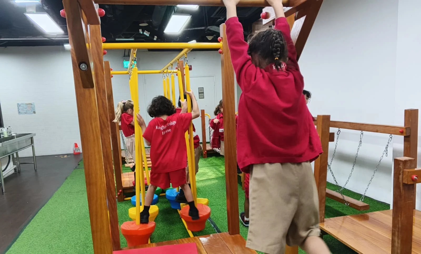 A group of KBH students playing in the Bukit Merah campus indoor playgroup