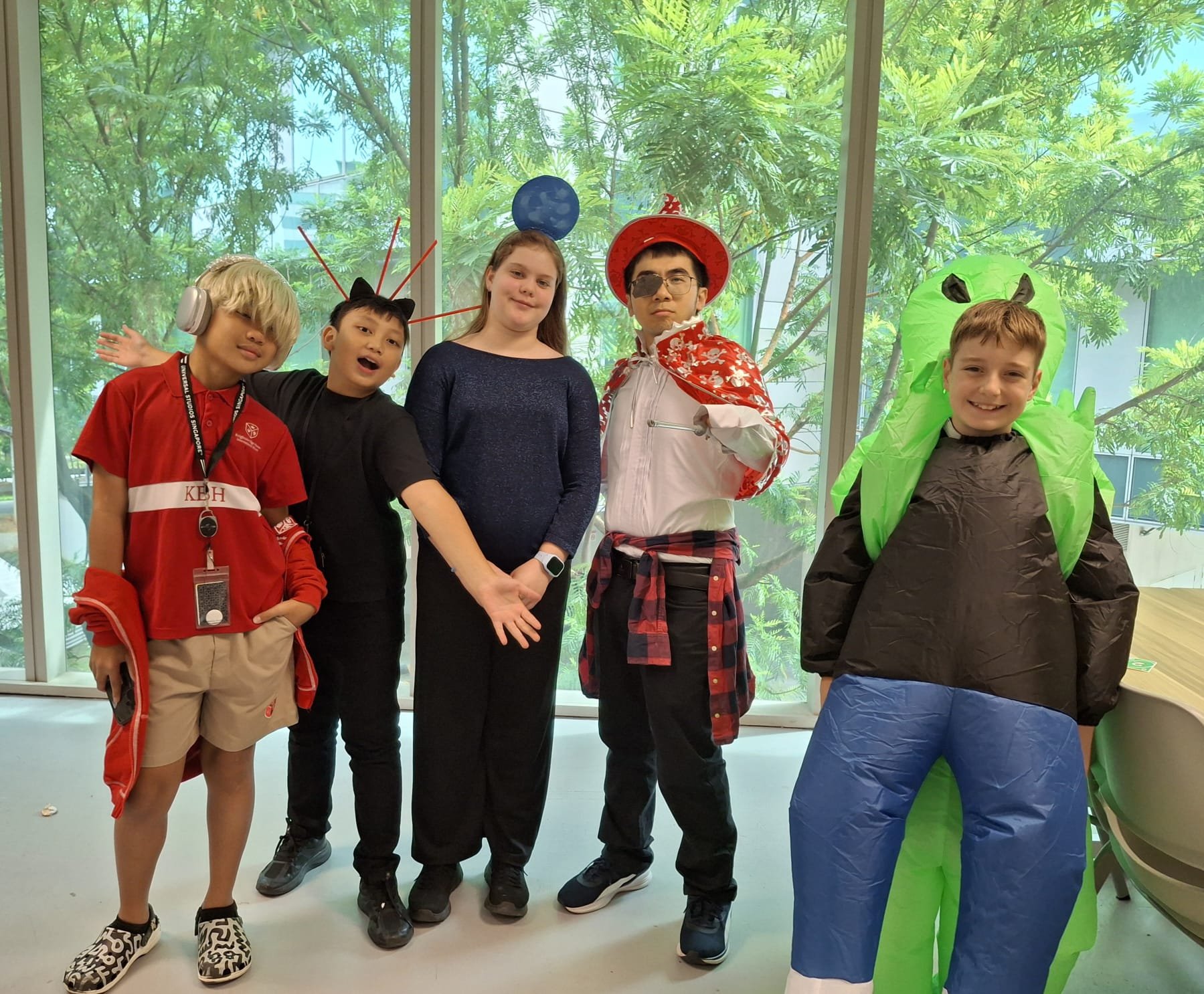 k12 cambridge international students posing and taking photo near plaza 8 changi business park singapore