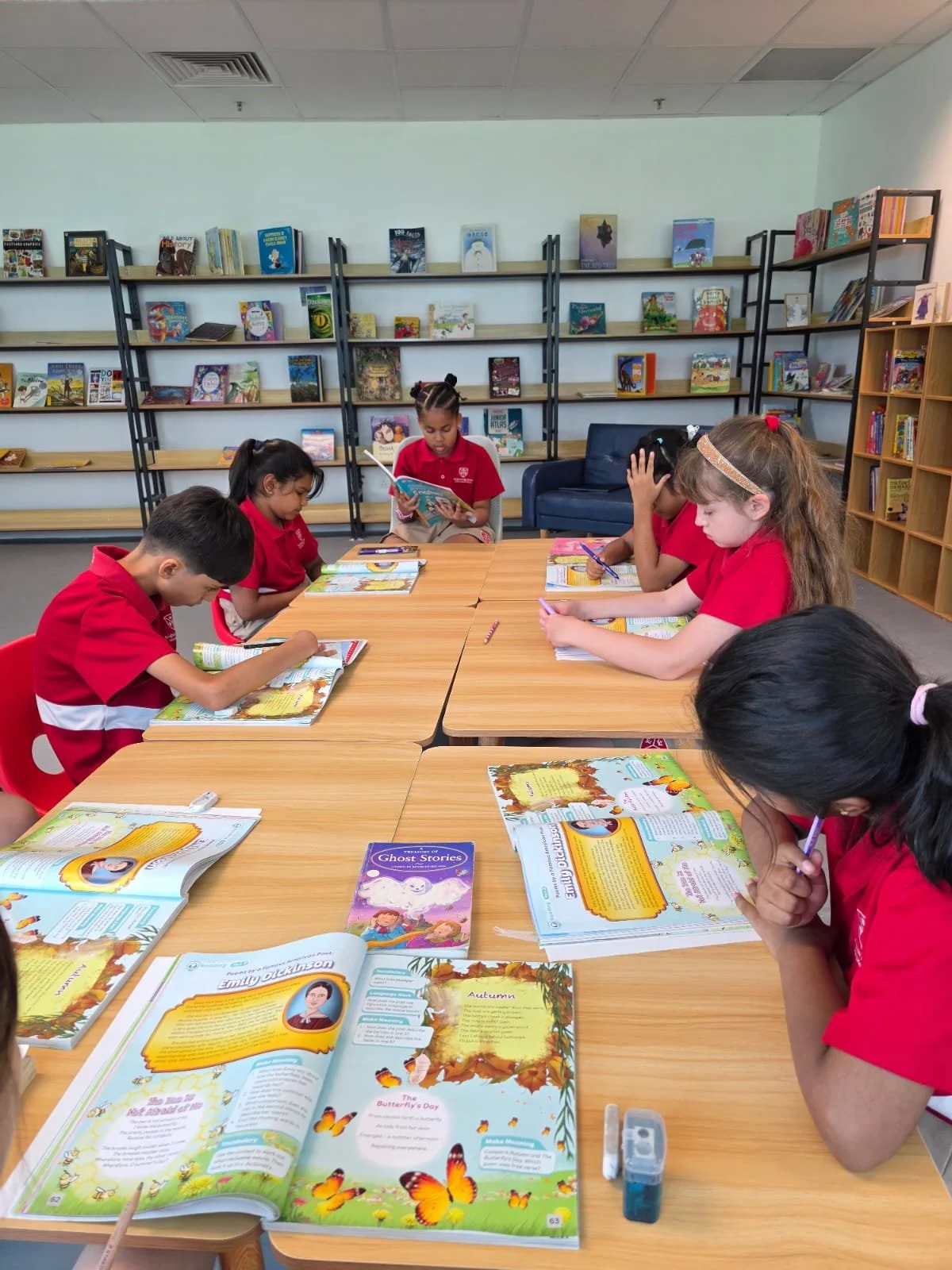 foreign international students reading and doing work in library