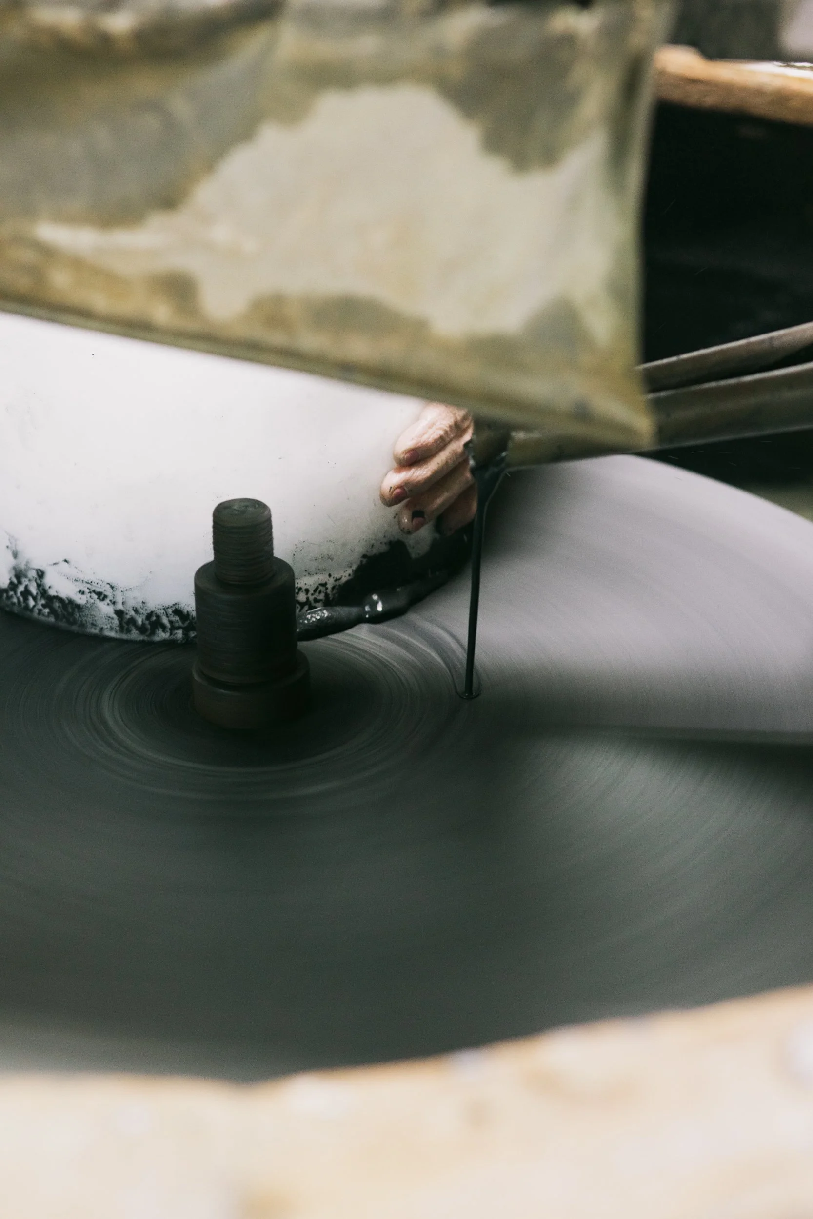 Close-up of a spinning vinyl record on a turntable with a stylus needle.