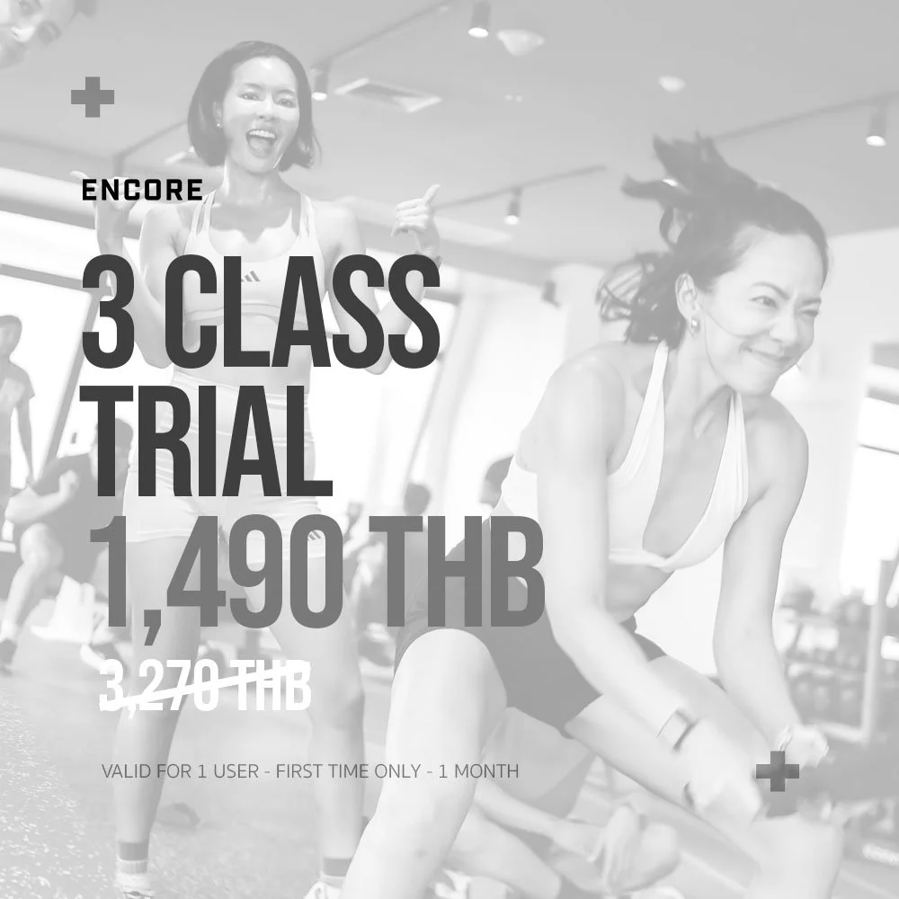 Women exercising at a fitness class, smiling and looking energized, with promotional text overlay advertising a 3-class trial offer for 1,490 THB.