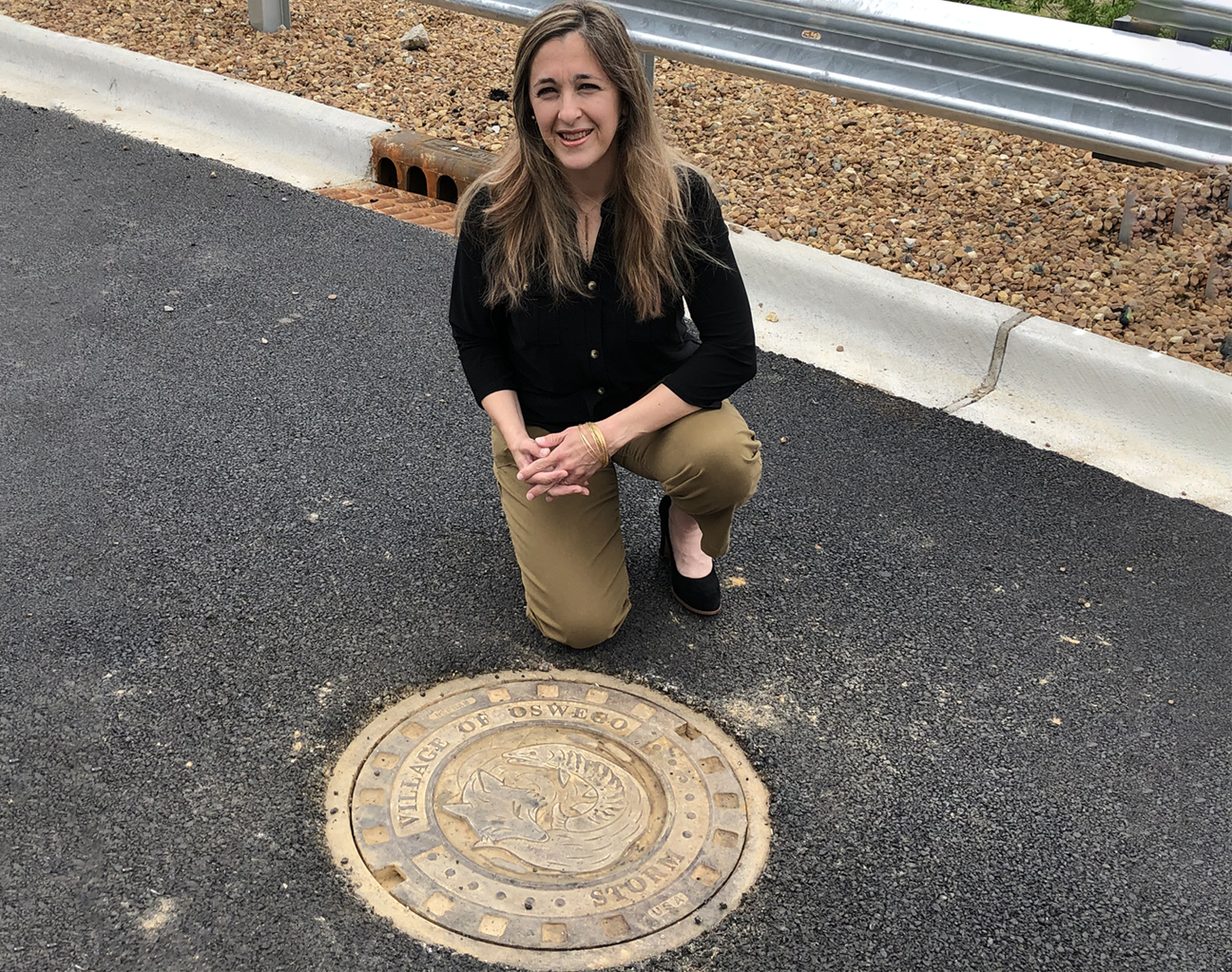 Artist Elizabeth Teitge with her manhole cover design.
