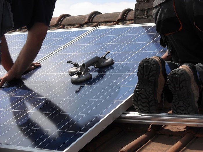 Solar panel being removed from a roof