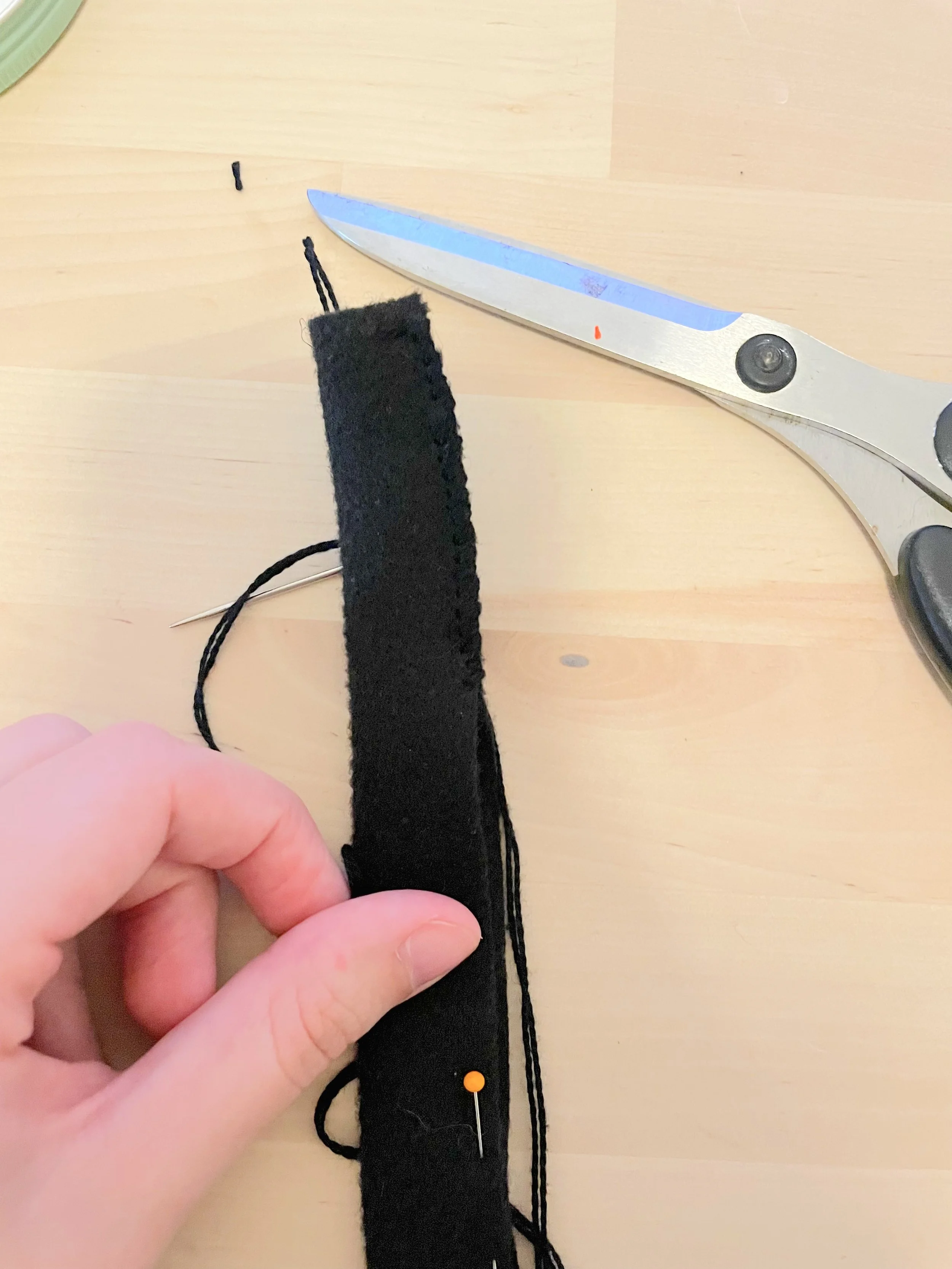 Folded the long strip in half and sewed it to create a "tube", and stuffed it with polyfill. 