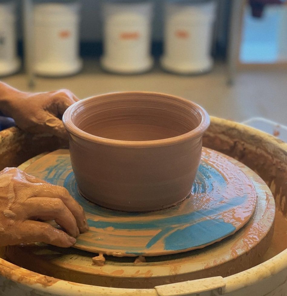 Potter at work at his pottery wheel 