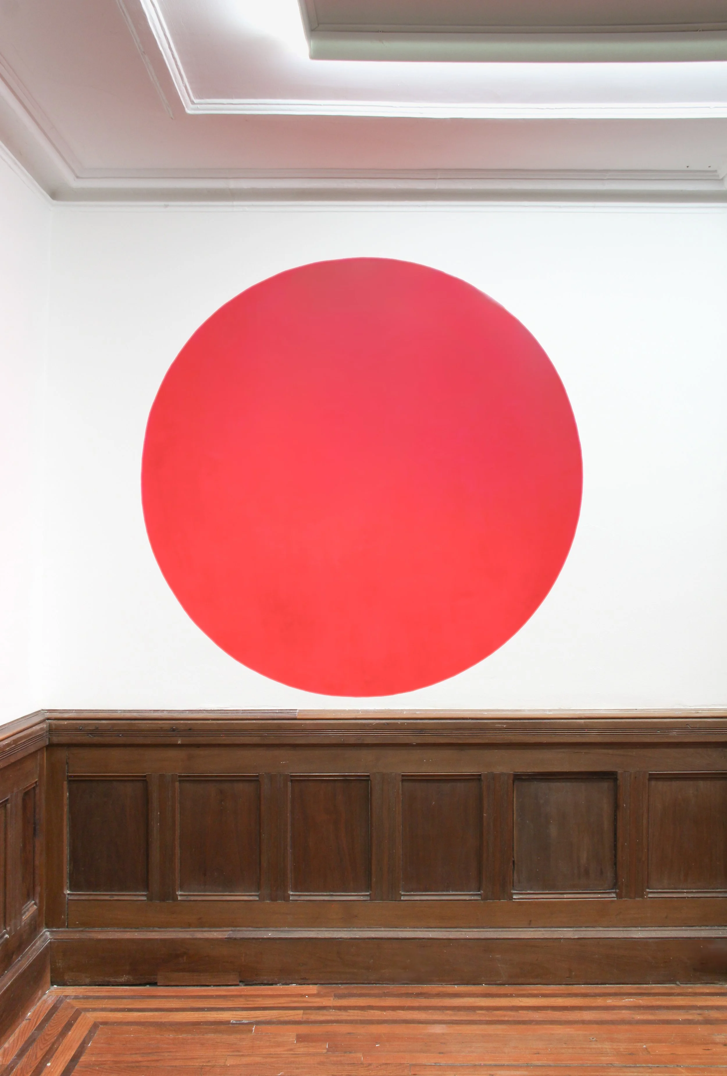 A Pink Dot, Pigment and Medium on wall, 55", 2024, Greene House, Brooklyn, NY