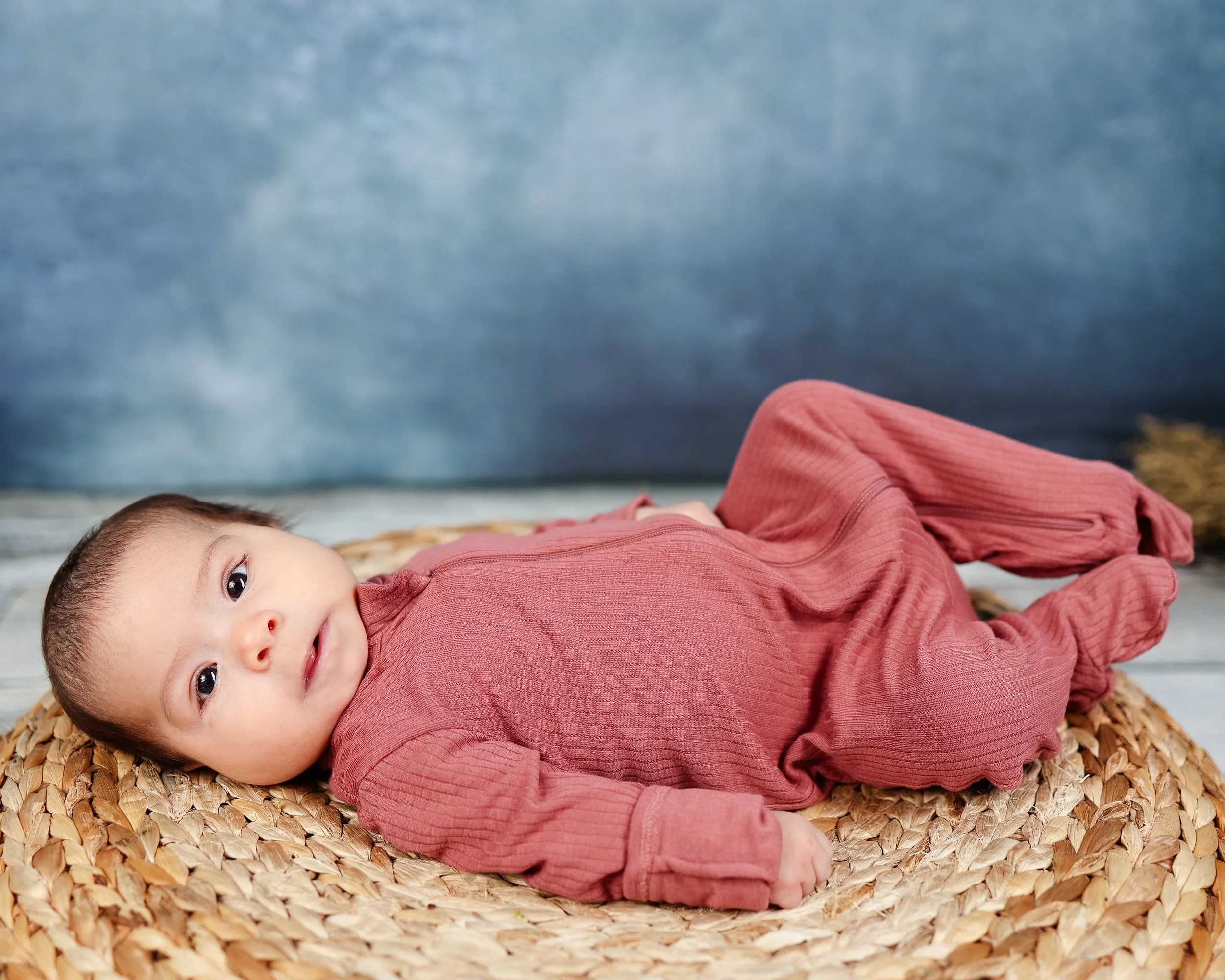 baby laying on back in school portrait Merritt Island florida Those Photo Ladies