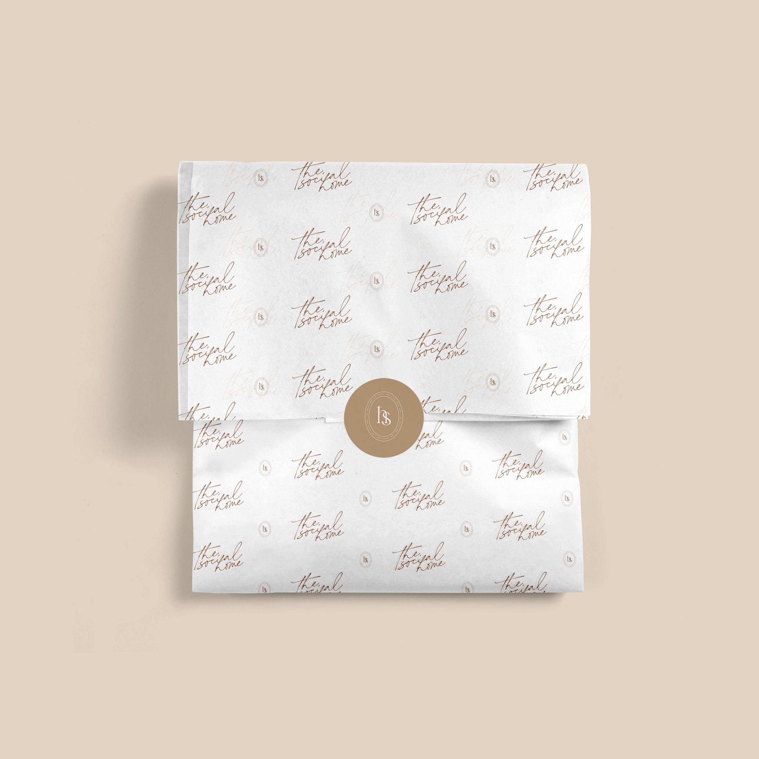 Elegant branded wrapping paper with logo and script text
