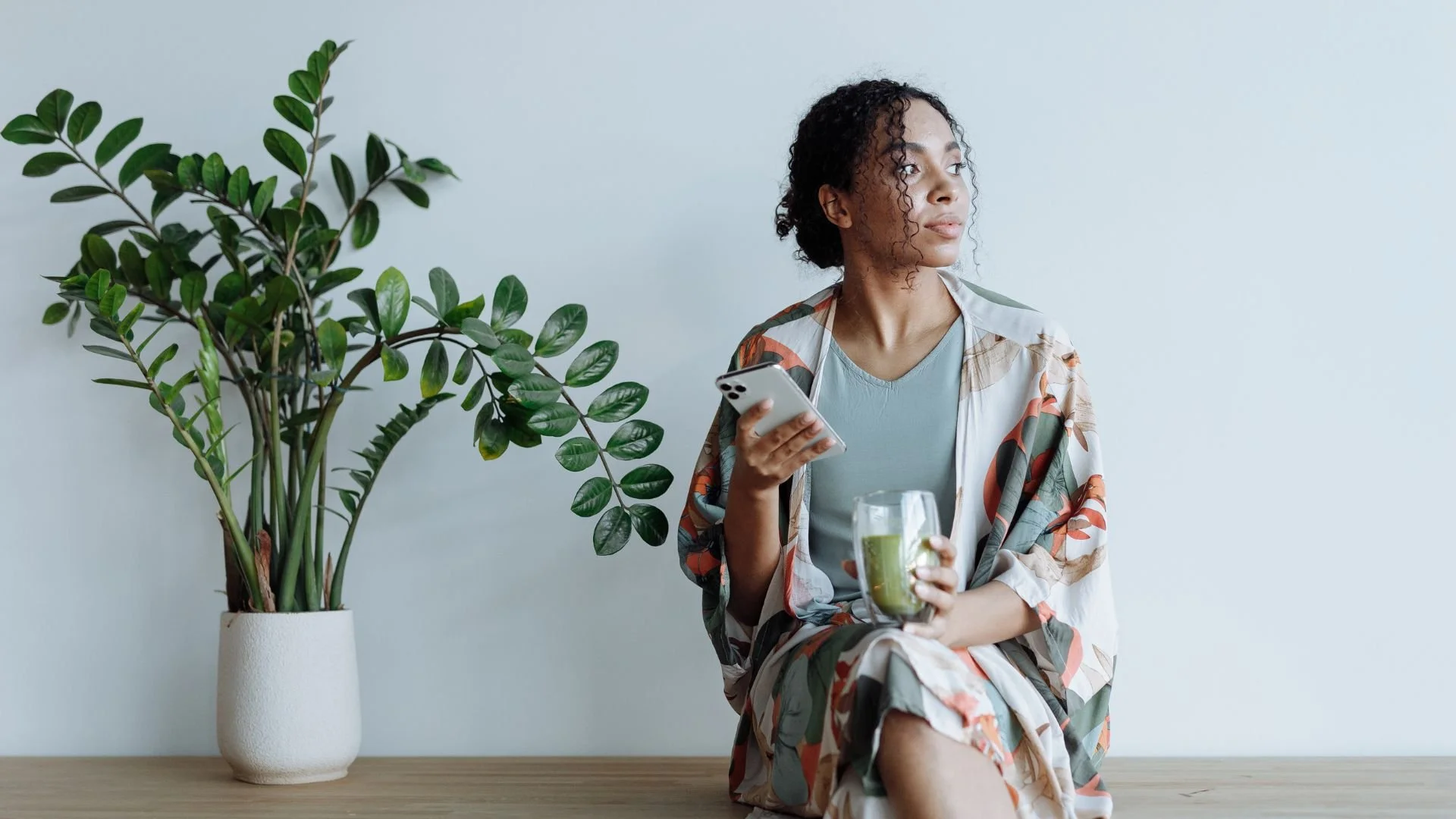 woman with green smoothie in quiet contemplation — individual transformation coaching with Esther Boykin, LMFT