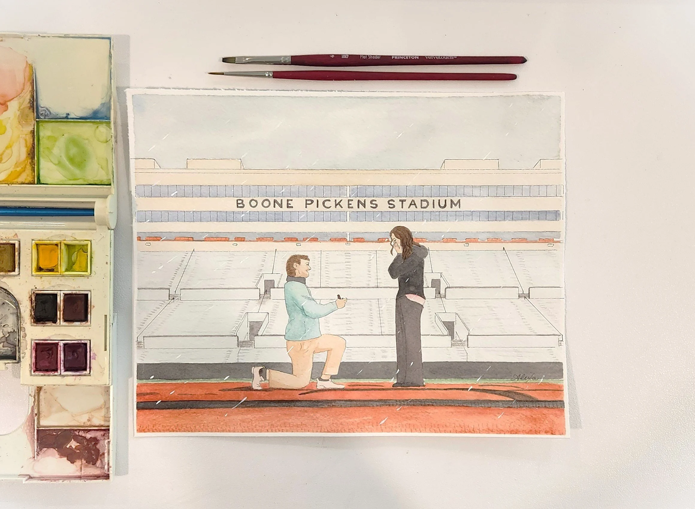 Watercolor painting of a man proposing to a woman at Boone Pickens Stadium, with the stadium in the background. Watercolor proposal portrait by Oklahoma wedding artist Alexa's Illustrations. 