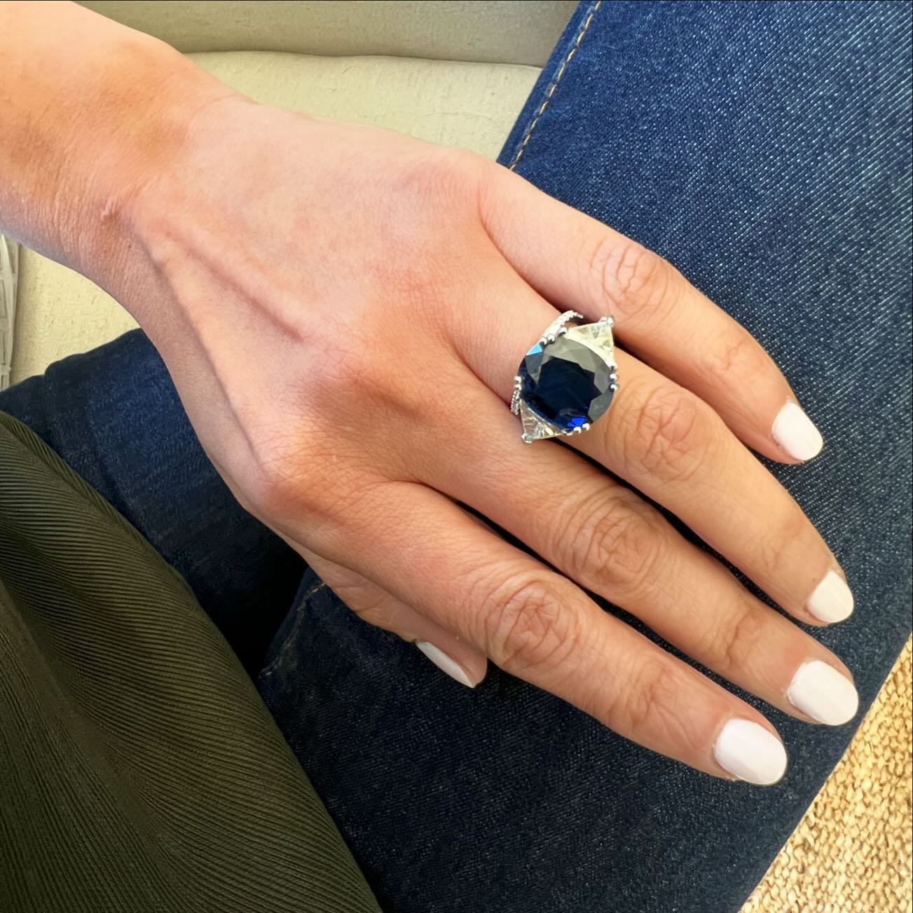 Delicious! 9.45ct oval sapphire with 1ct each trillions!